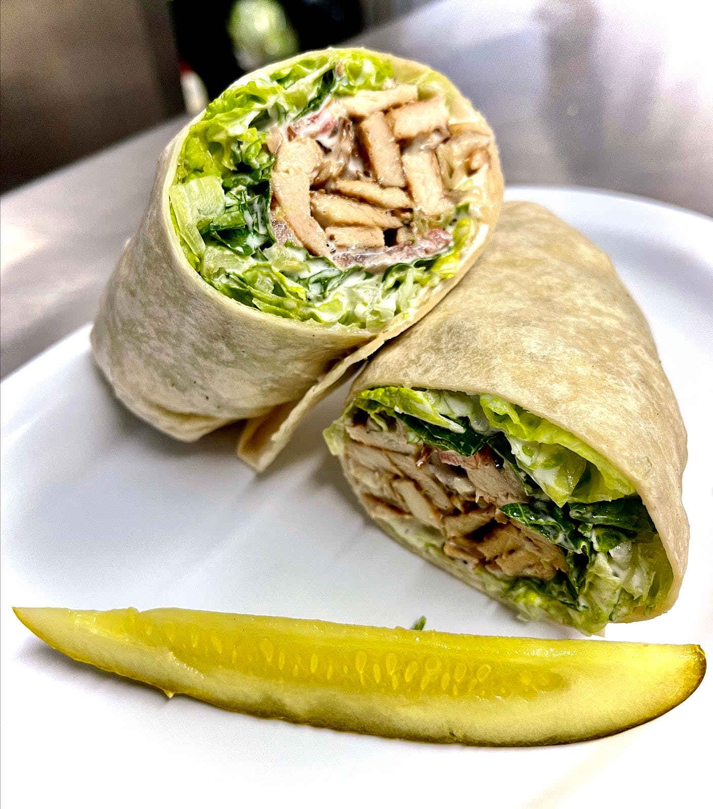 Order Grilled Chicken Caesar Wrap - Wrap food online from Sonny Restaurant & Pizzeria store, Englewood on bringmethat.com