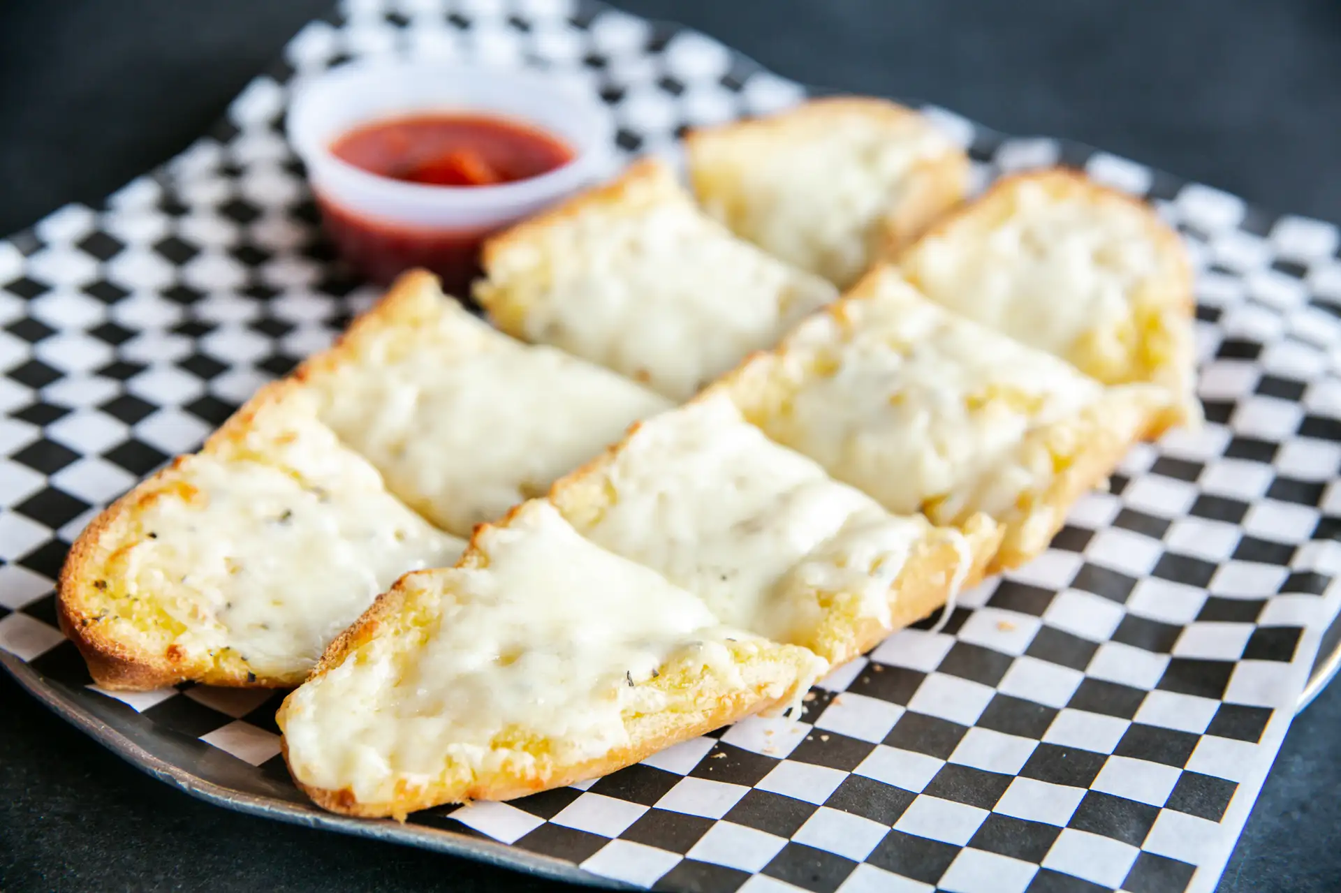 Order Garlic Bread with Cheese food online from Johnny's New York Pizza & Pasta store, Denver on bringmethat.com