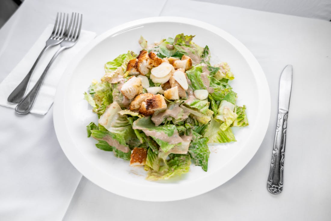 Order Garlic Salad - Salad food online from Alessios Seafood Grille store, Warrington on bringmethat.com