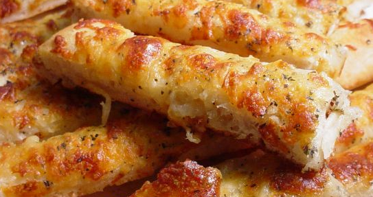 Order Garlic and Cheese Breadsticks food online from Italian Delights & Pizzas store, Los Angeles on bringmethat.com