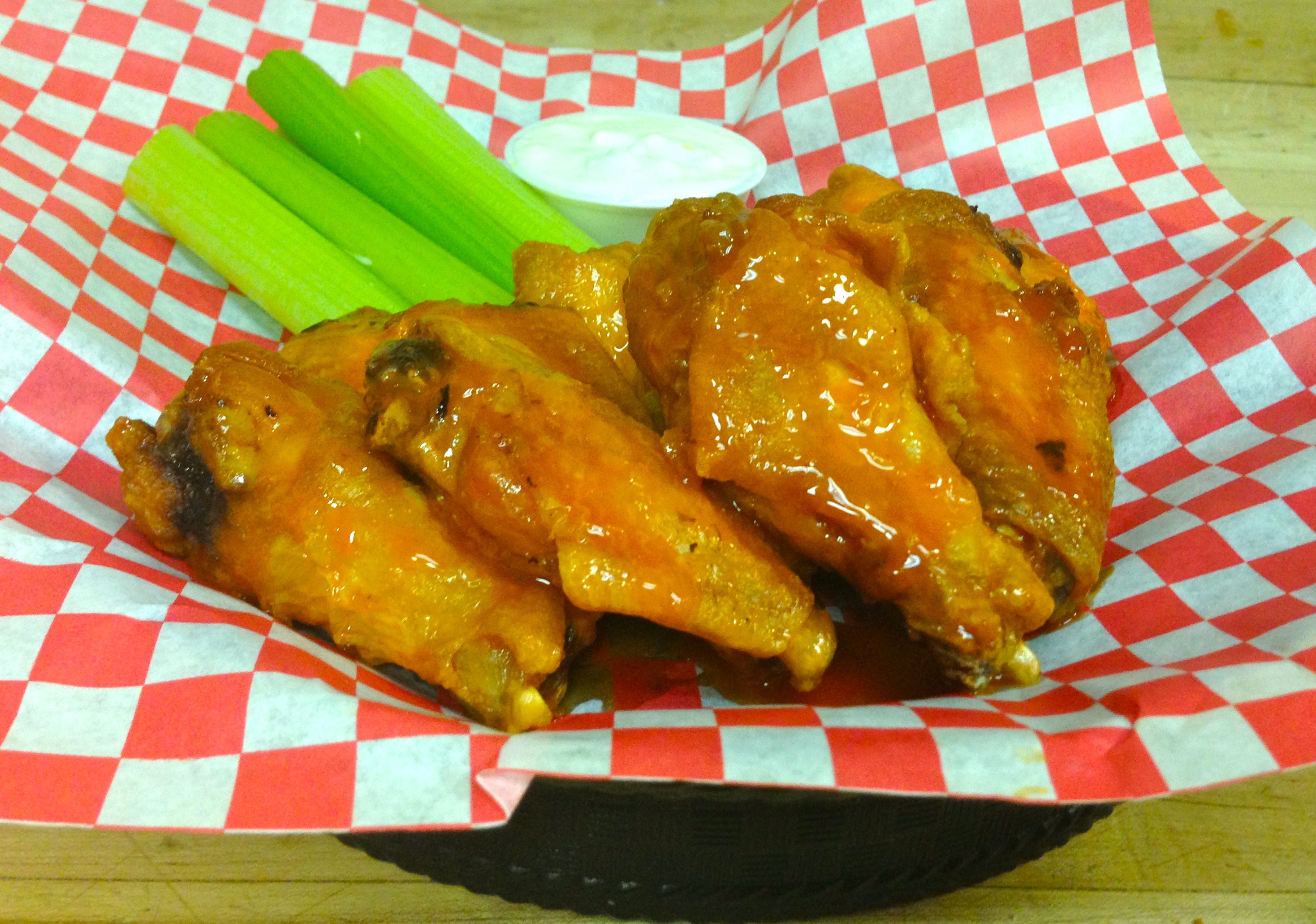 Order 10 Traditional Wings food online from Cuzino's store, Bear on bringmethat.com