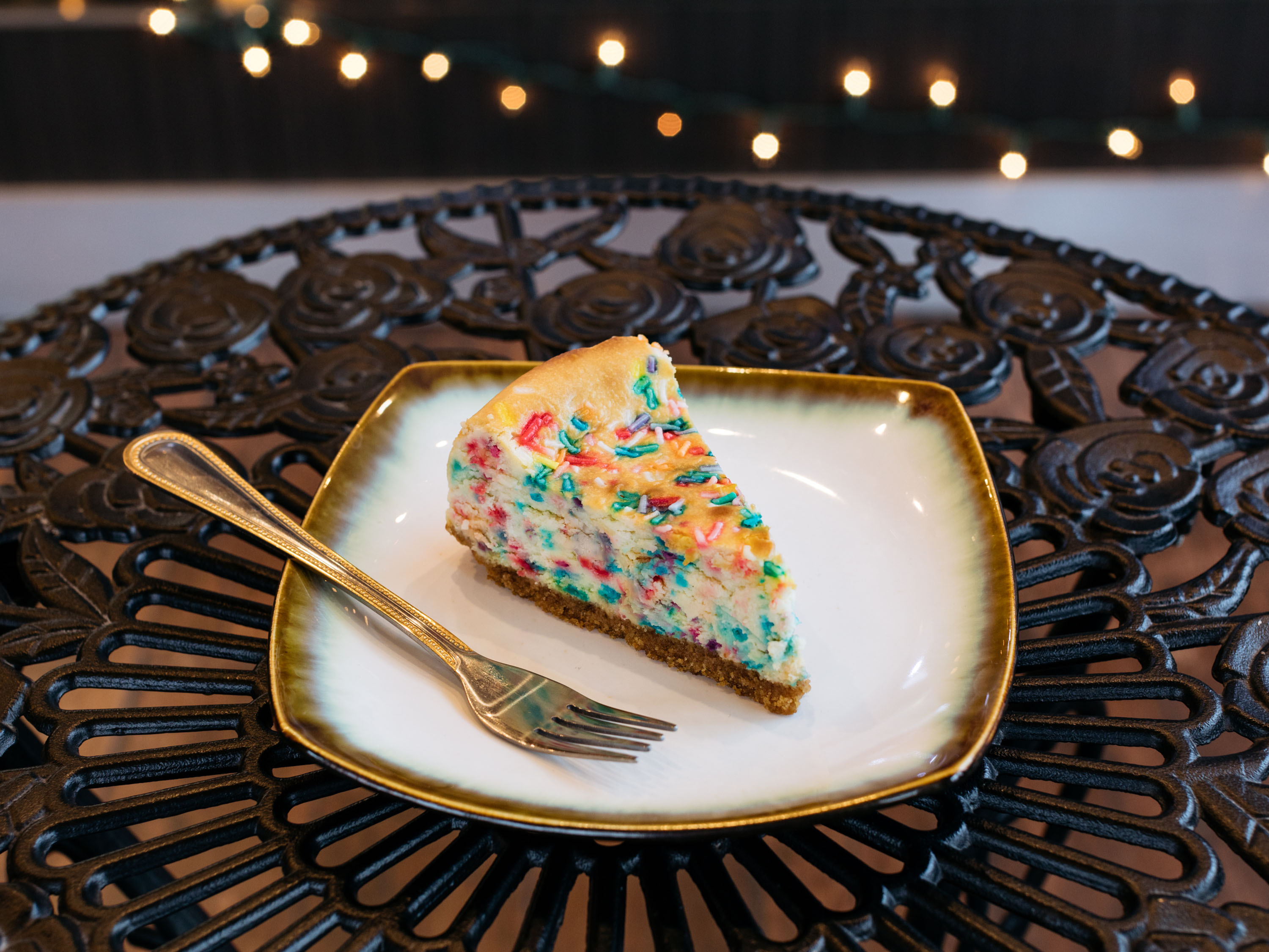 Order Funfetti Cheesecake Slice food online from Cheat Treats Cafe store, Dearborn on bringmethat.com