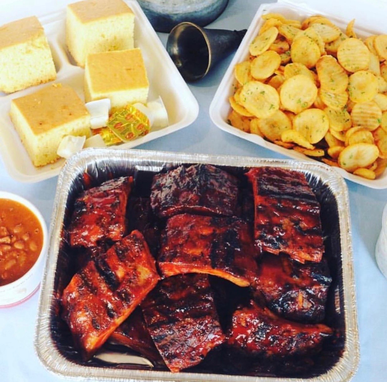 Order Baby Back Package for 4 food online from Tulsa Rib Company store, Orange on bringmethat.com