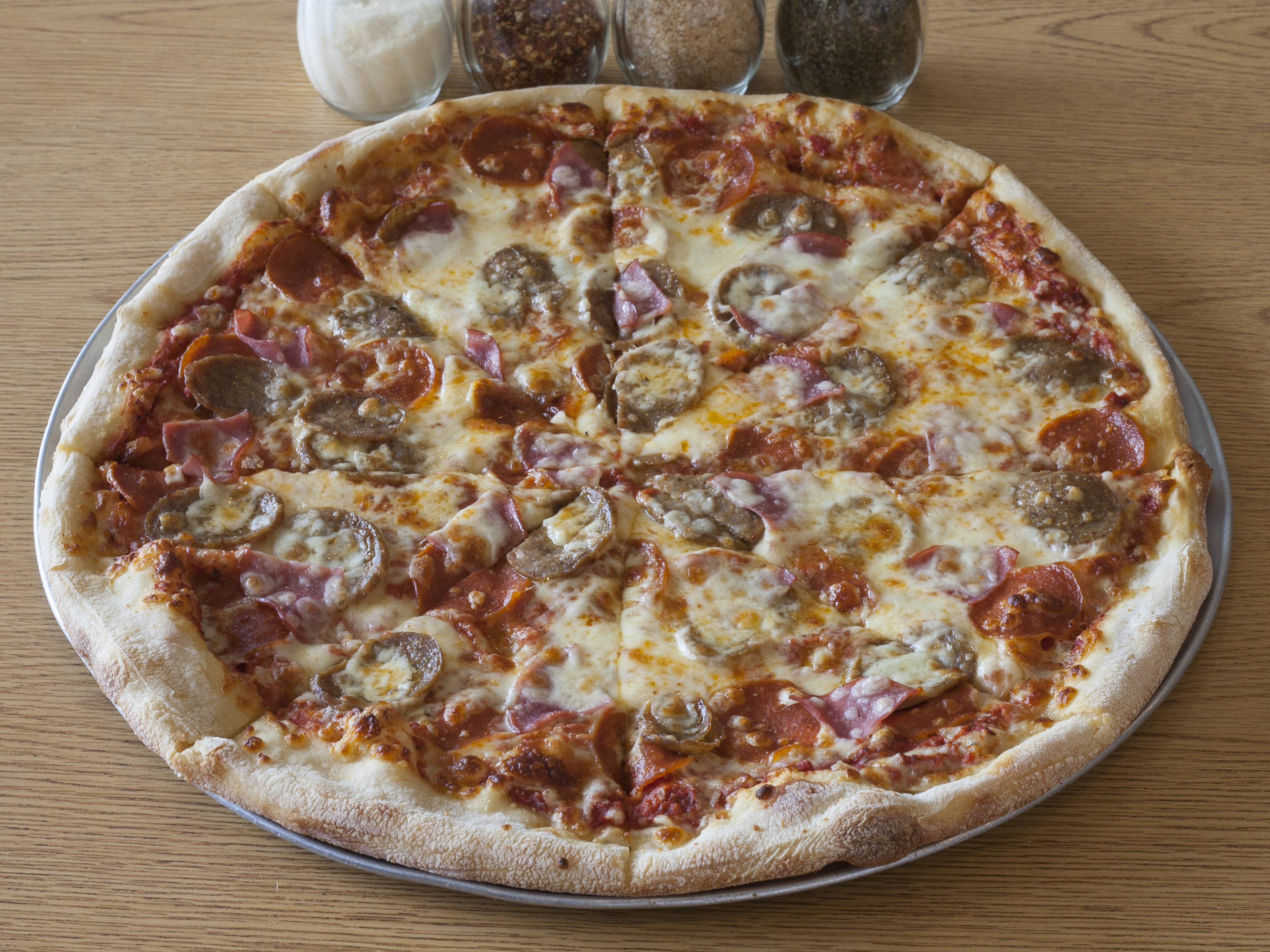 Order Meat Lovers Pizza food online from Abo's Pizza store, Broomfield on bringmethat.com