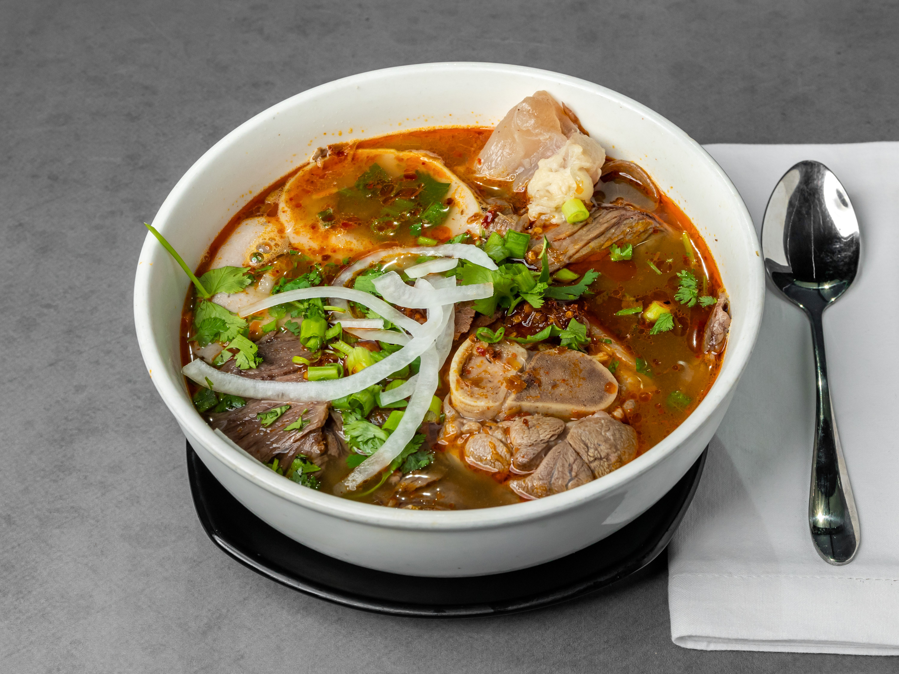 Order 77. Spicy Beef and Pork Noodle Soup food online from T-Pho Noodle And Grill store, Fontana on bringmethat.com