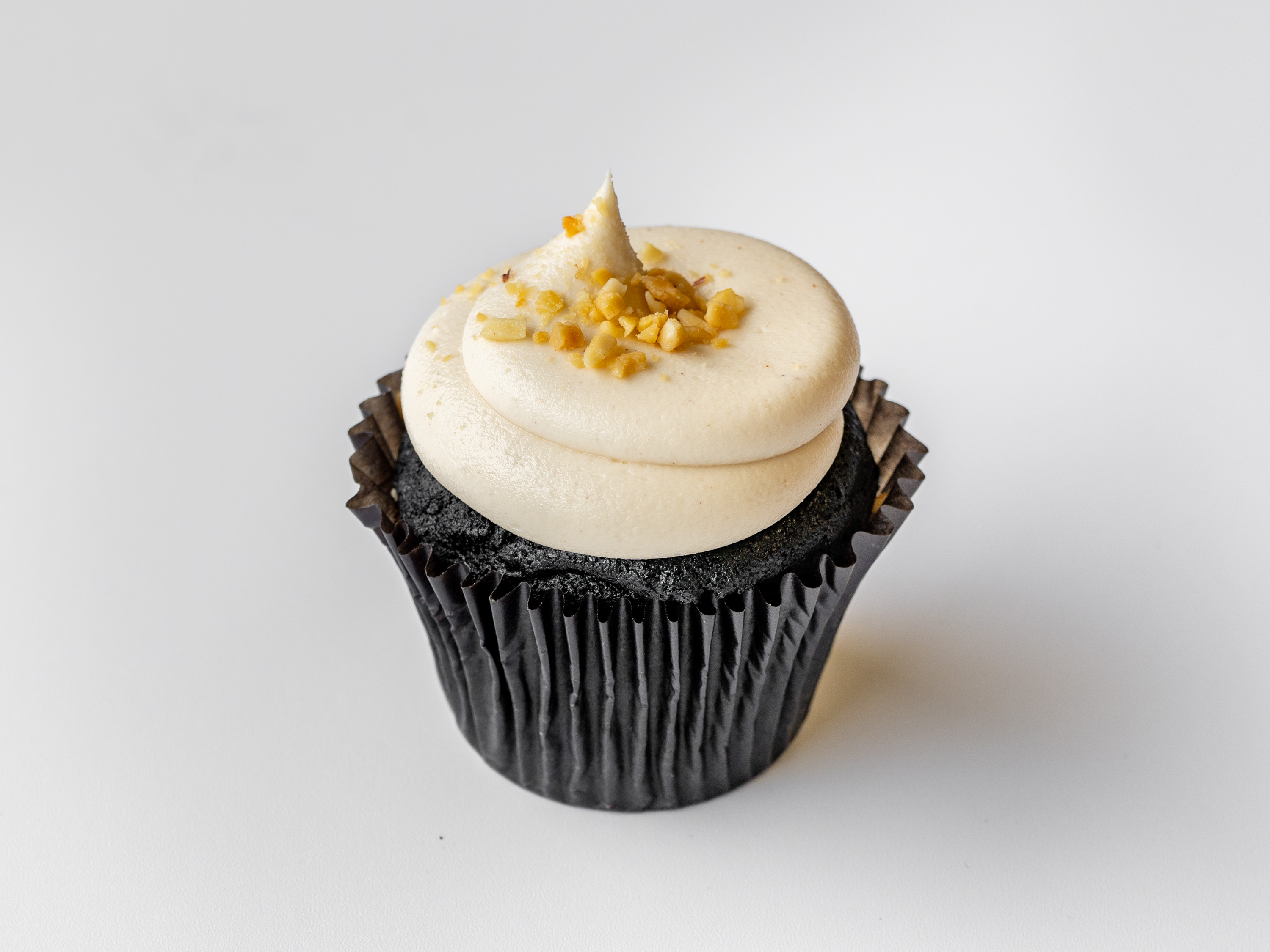 Order Peanut Butter Cup Classic Cupcake food online from Yummy Cupcakes store, Encinitas on bringmethat.com