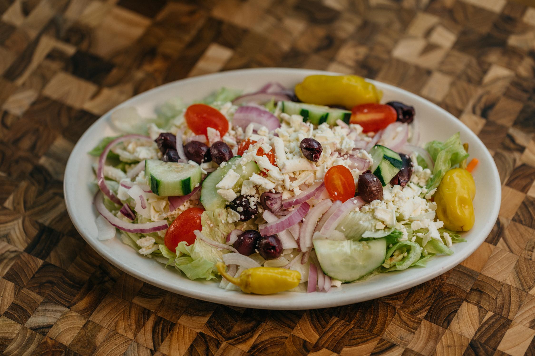 Order Greek Salad food online from Tony's NY Pizza store, Oakton on bringmethat.com