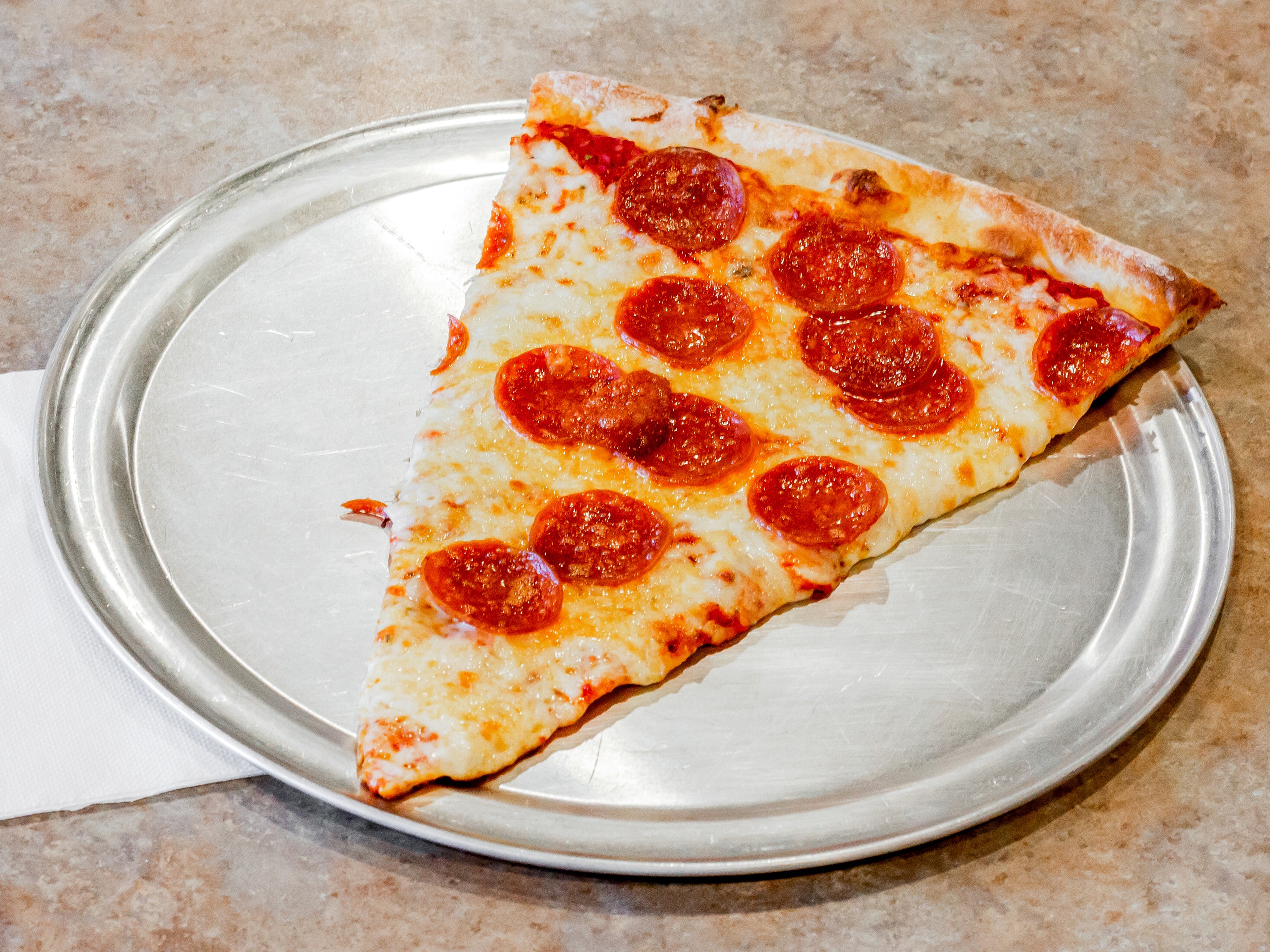 Order Pepperoni Pizza by The Slice food online from Tony's Pizza store, Jacksonville on bringmethat.com