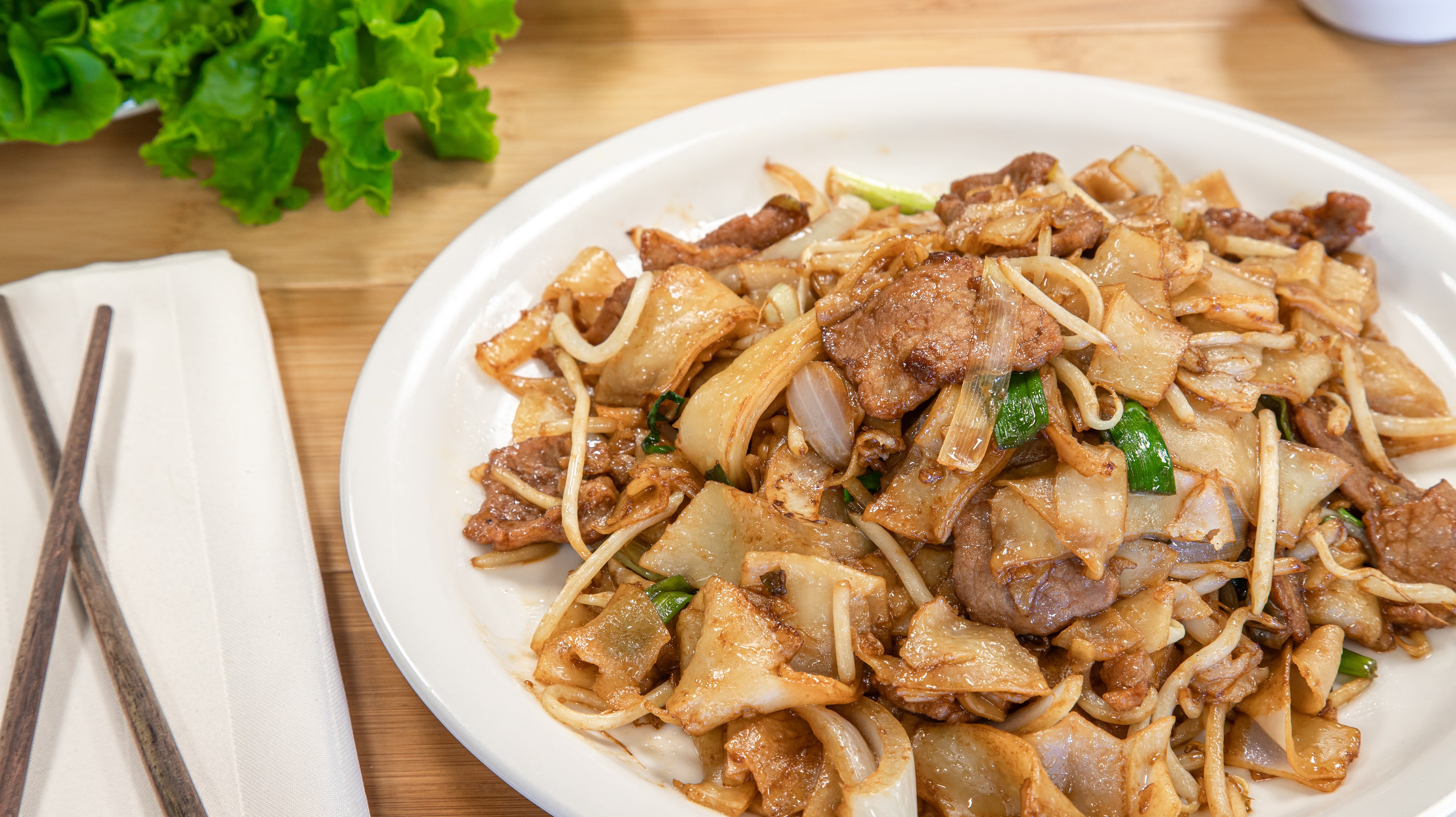 Order 72. Dry Fried Beef Chow Fun food online from Pho Cafe Hong Kong Diner store, Reno on bringmethat.com