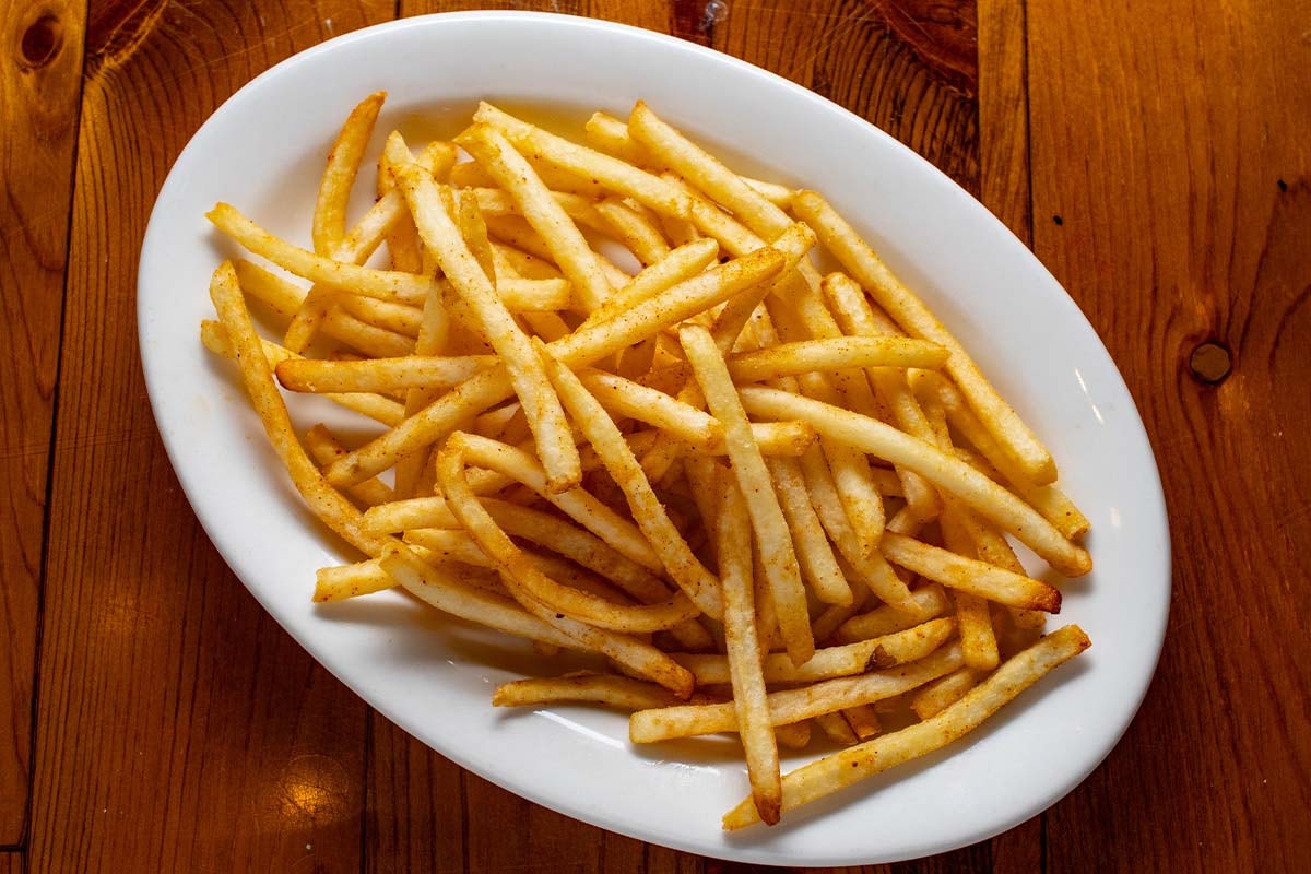 Order French Fries food online from Boudreaux Cajun Kitchen store, Houston on bringmethat.com