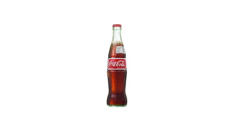 Order Mexican Coke (12 oz bottle) food online from MOD Pizza store, Prosper on bringmethat.com