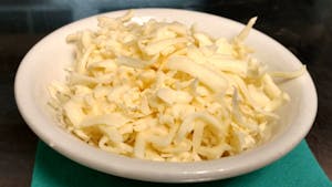 Order Shredded Cheese food online from La Tolteca store, Williamsburg on bringmethat.com