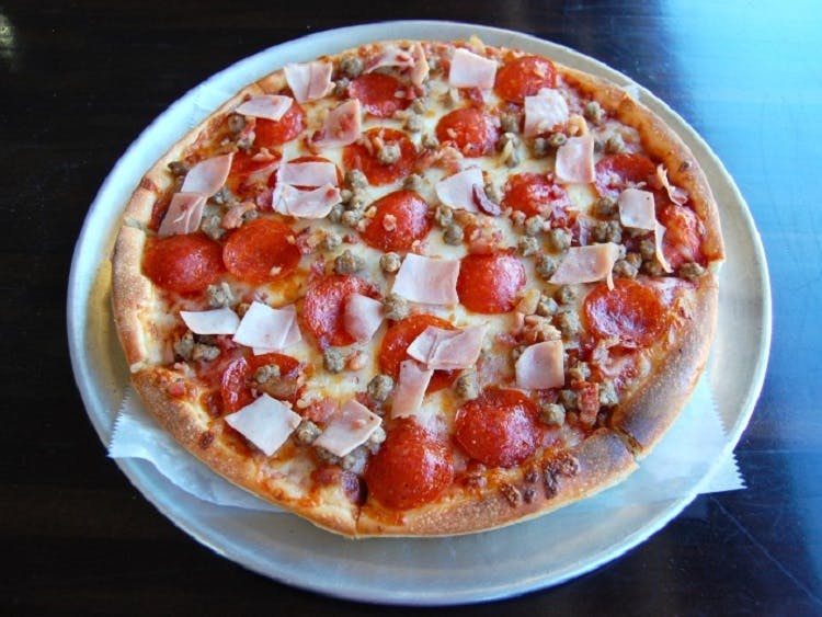 Order Meat Eaters Pizza - Mini 10'' food online from Claymont Steak Shop store, Claymont on bringmethat.com