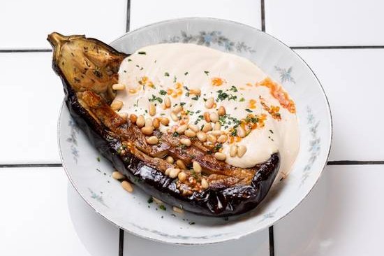 Order Baladi Eggplant food online from 12 chairs store, New York on bringmethat.com