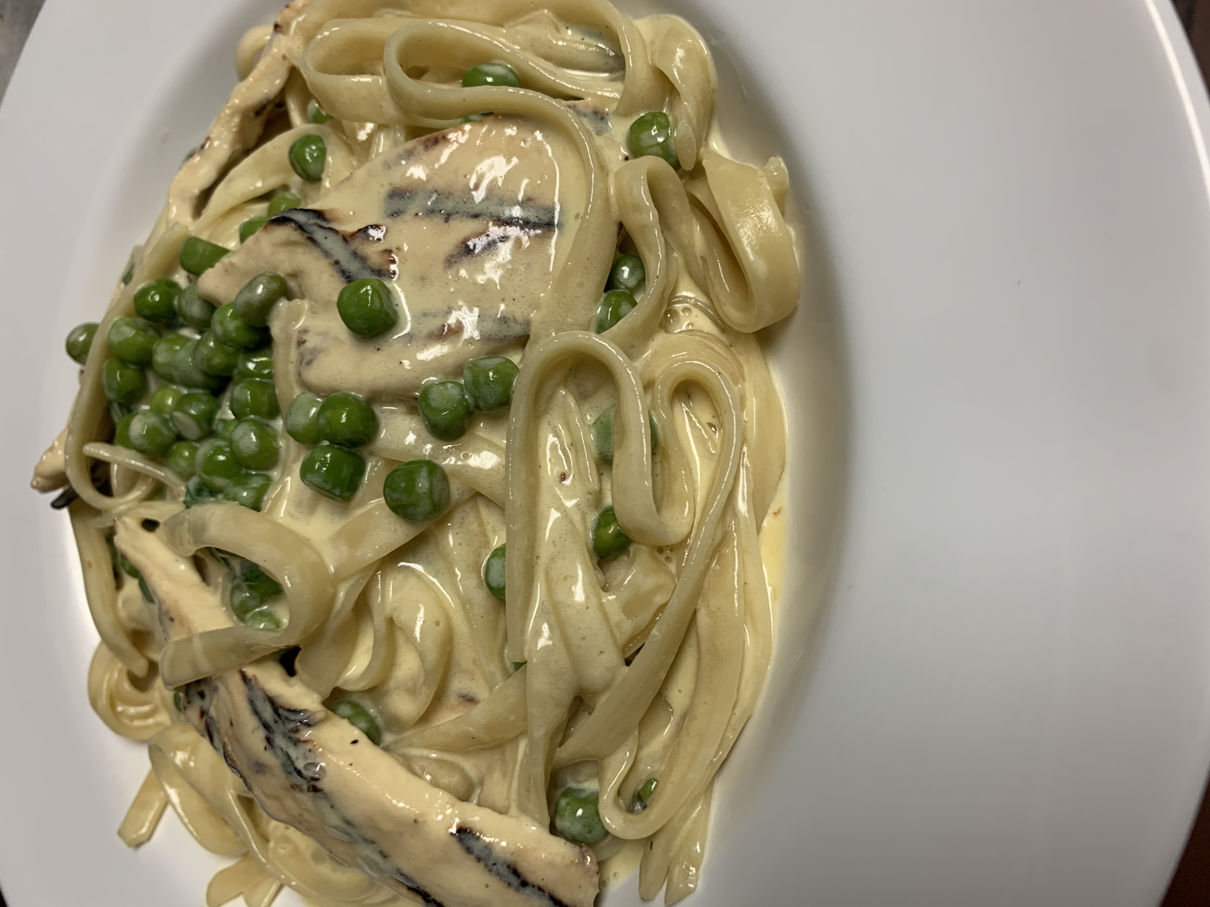 Order Fettuccini Alfredo With Grilled Chicken & Green Peas food online from Taste of Italy Pizza store, Corona on bringmethat.com