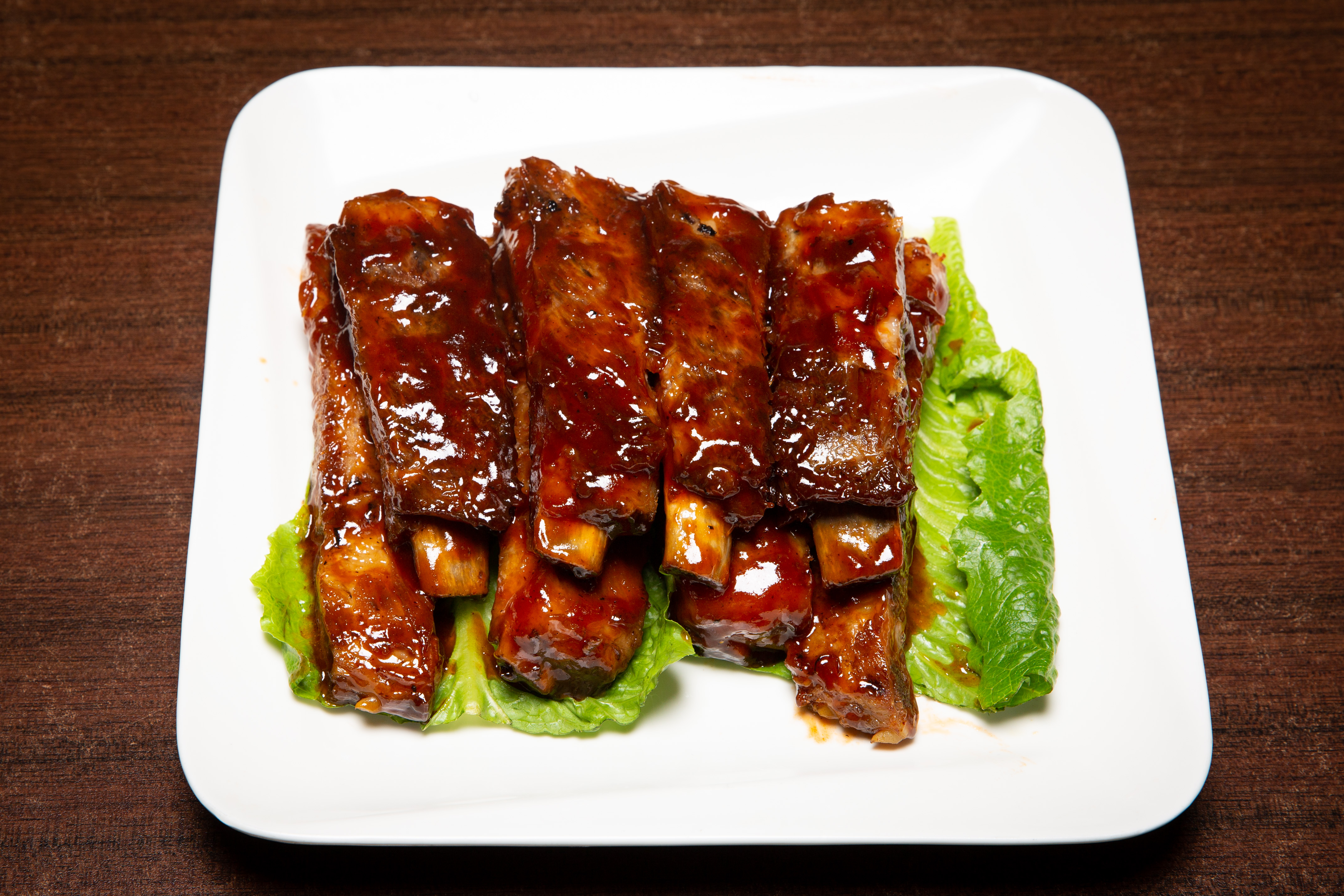 Order 11. Smoked BBQ Spare Ribs food online from Wei Buffet store, Roselle Park on bringmethat.com