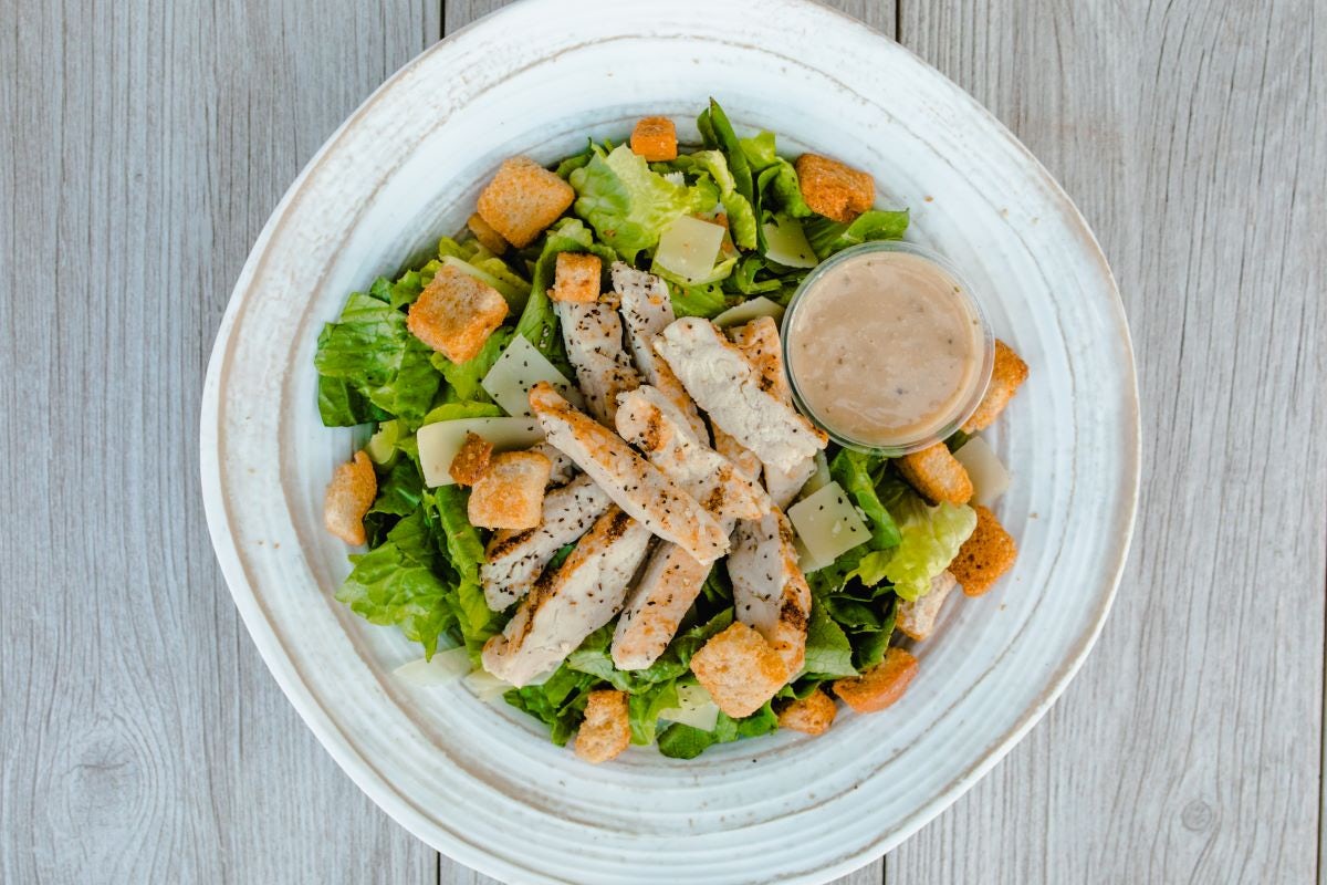 Order Chicken Caesar Salad food online from Pizzarev store, Corona on bringmethat.com