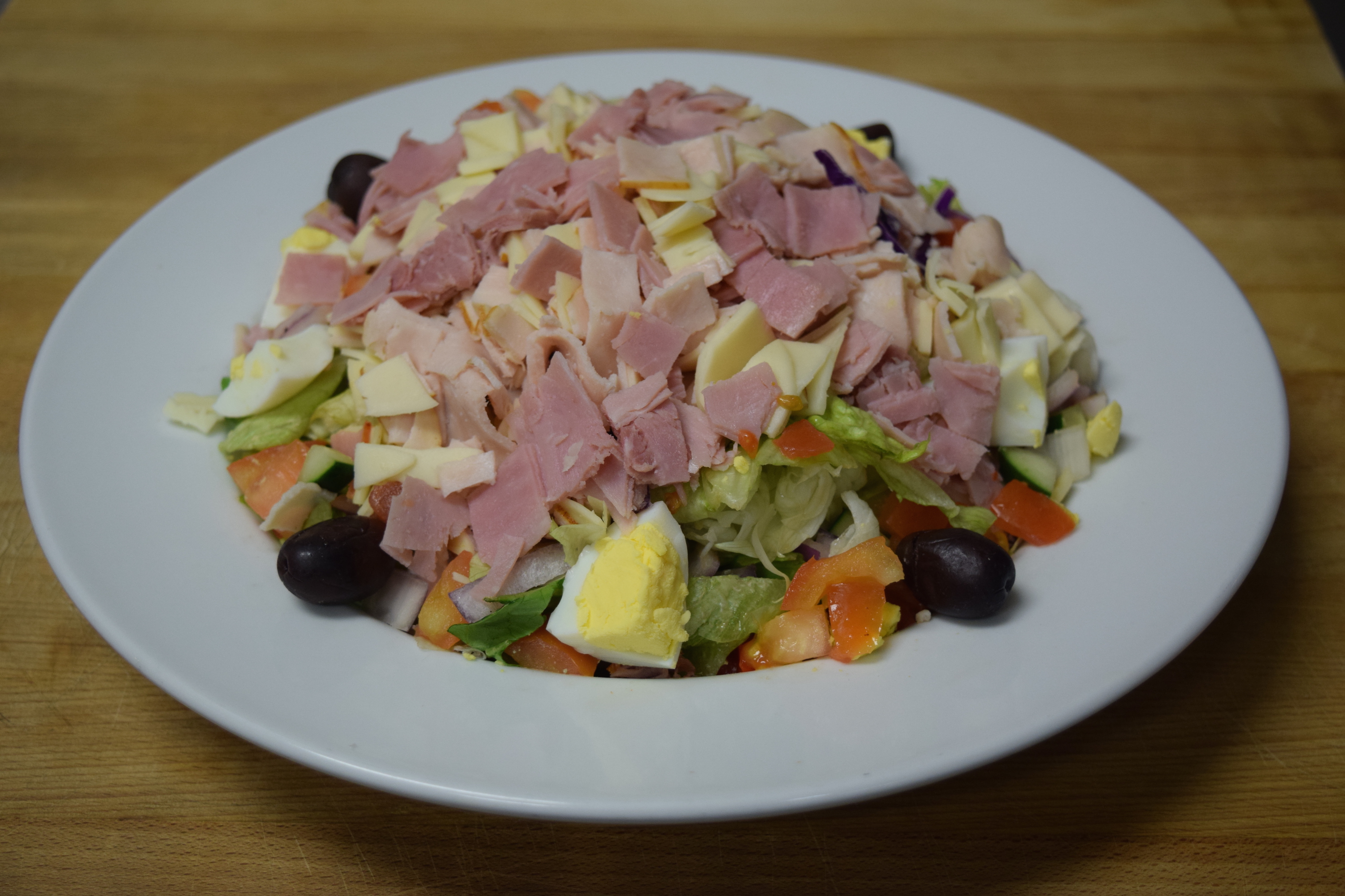 Order Chopped Chef Salad food online from Cuzino Pizza & Pasta store, Smyrna on bringmethat.com