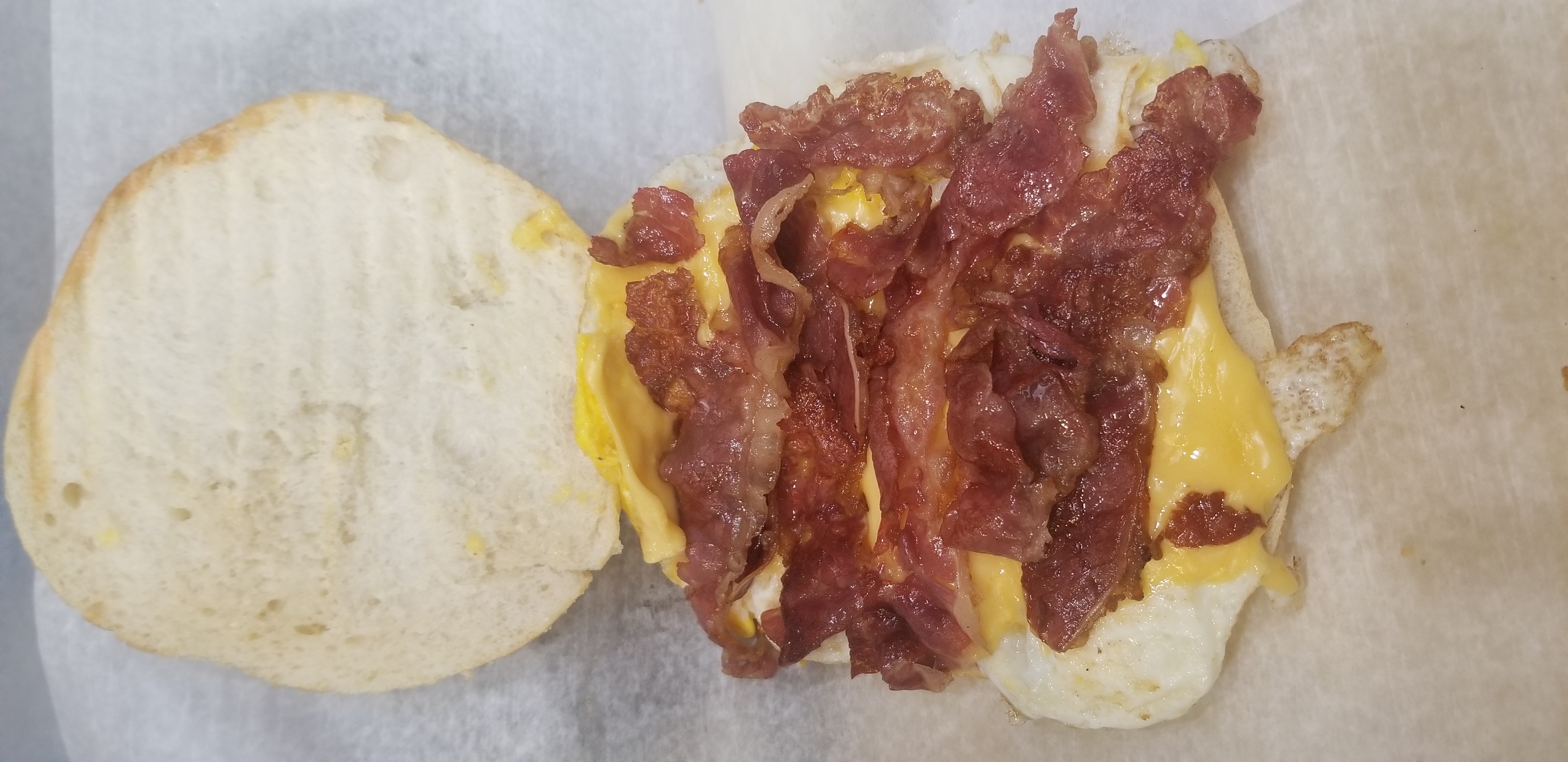 Order Bacon, Egg and Cheese Sandwich food online from Day & Night Deli store, Brooklyn on bringmethat.com