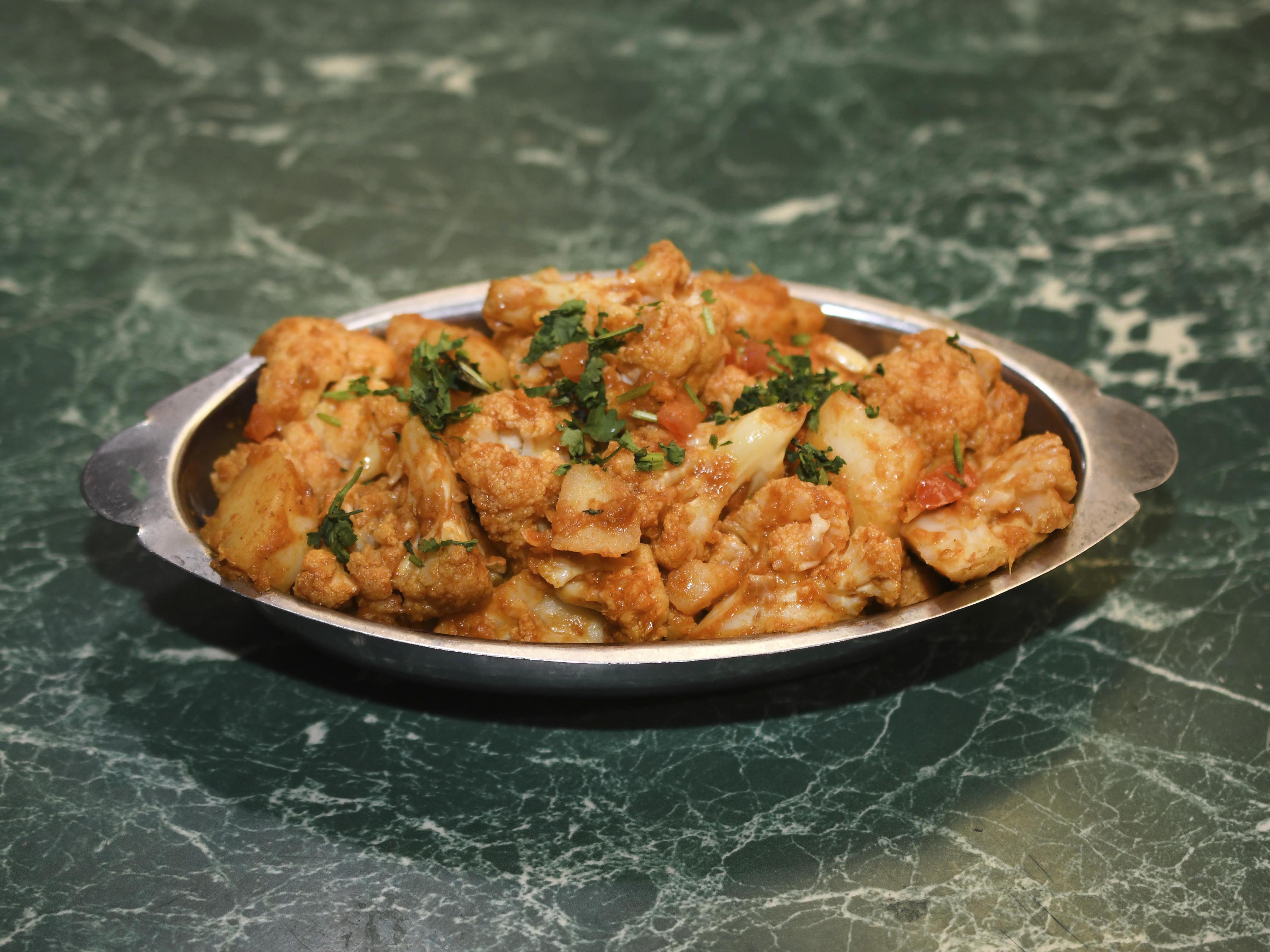 Order Aloo Gobhi food online from India Kabob & Curry store, Reno on bringmethat.com