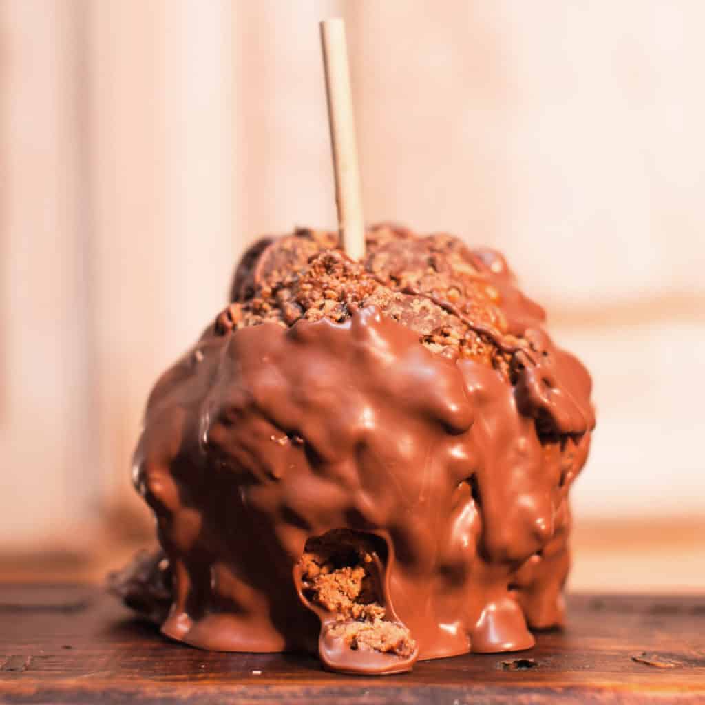 Order Peanut Butter Cup Caramel Apple with Milk Chocolate food online from Candy Apple Shoppe store, Glenwood on bringmethat.com