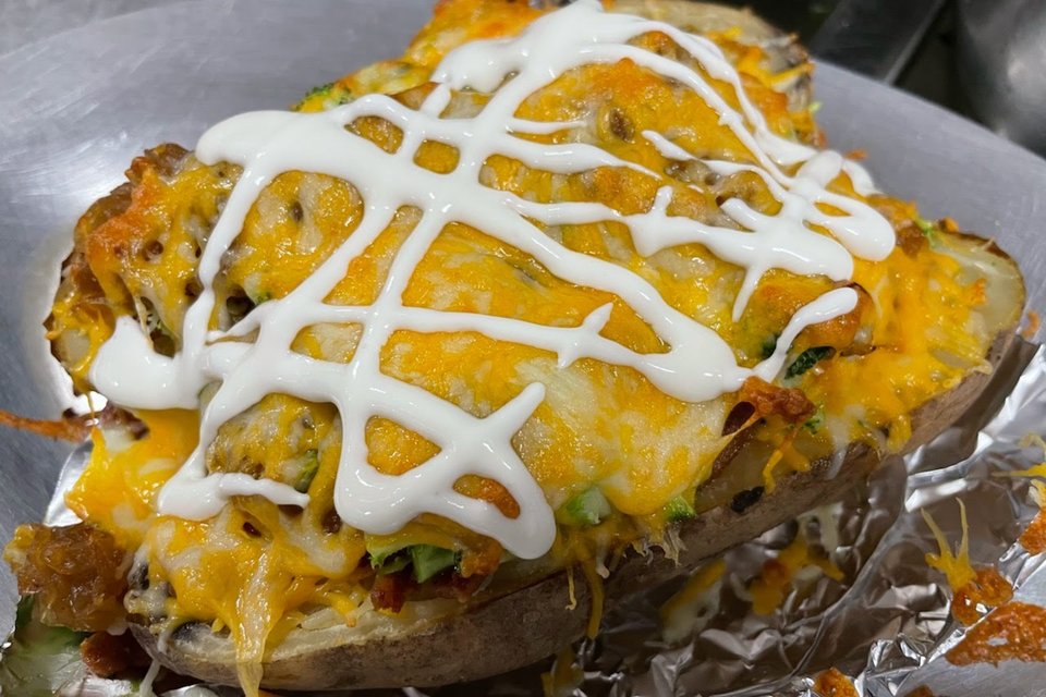 Order Loaded Baked Potato food online from La Esquina store, New York on bringmethat.com