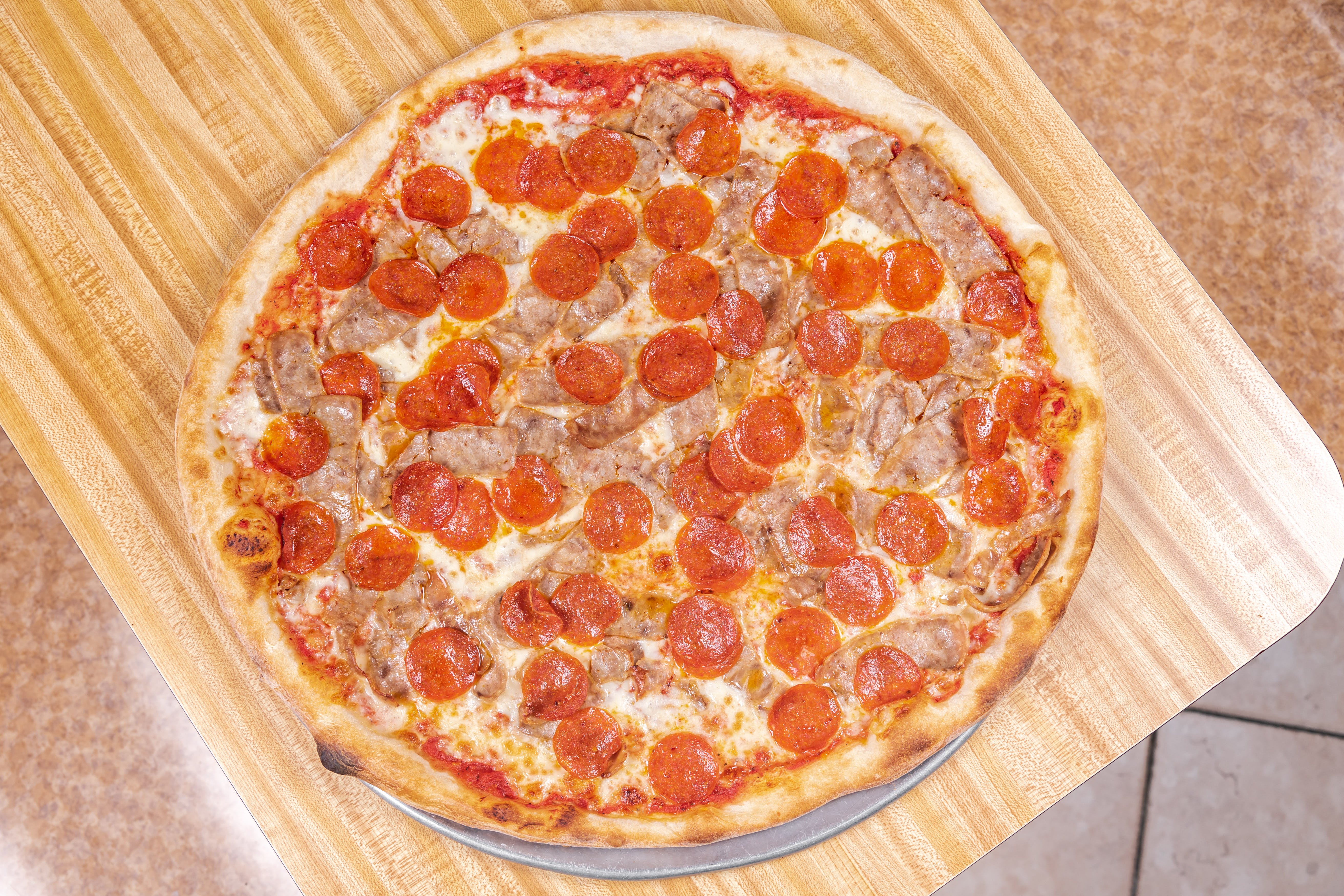 Order Any Two Toppings Pizza Slice - Slice food online from Riuniti Pizzeria & Restaurant store, Carteret on bringmethat.com