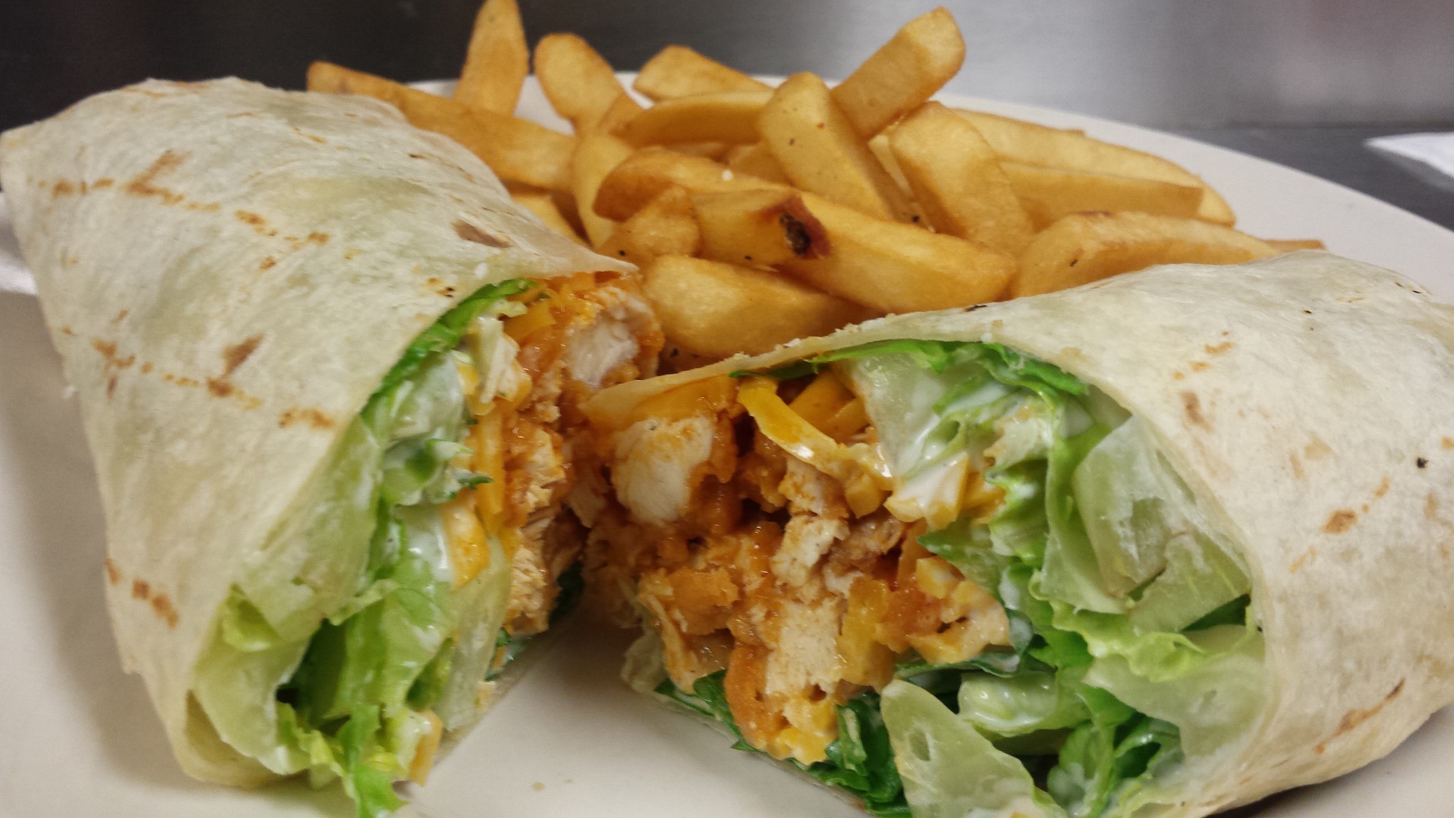 Order Buffalo Chicken Wrap with Fries food online from Level 20 Sports Restaurant store, Bethel Park on bringmethat.com