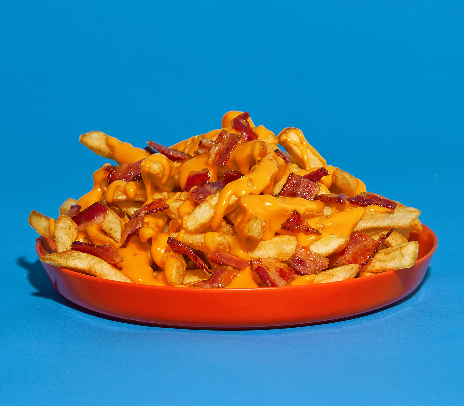 Order Bacon Cheese Fries food online from Cheeky's Cheesesteaks store, Nashville on bringmethat.com