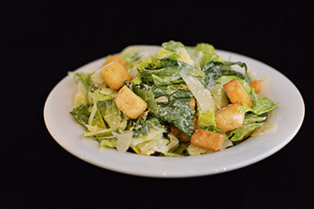 Order Caesar Salad food online from Strong's Brick Oven Pizzeria store, Hebron on bringmethat.com