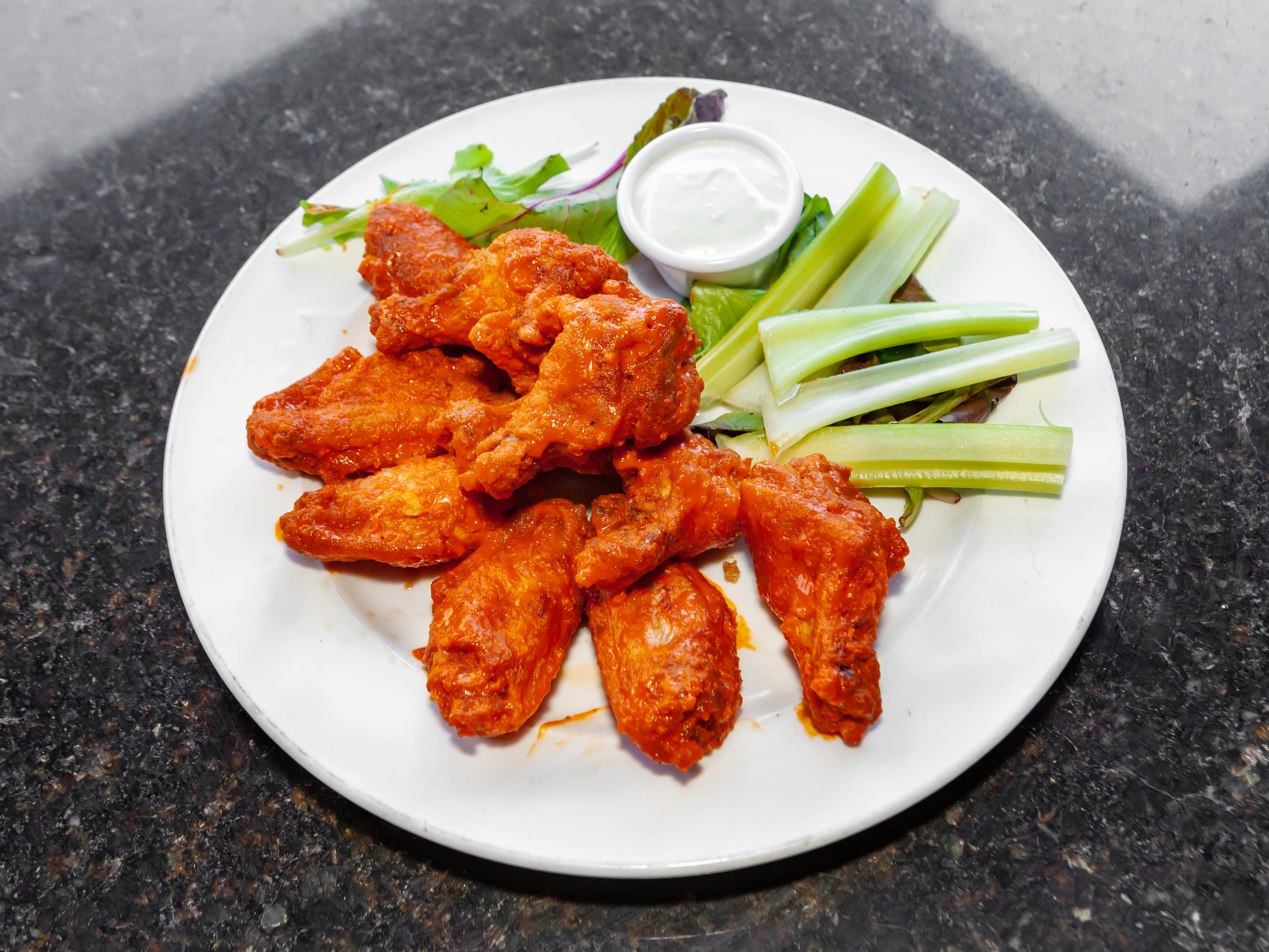 Order Wings food online from The Islander Tiki Bar & Grille store, Palm Beach Shores on bringmethat.com