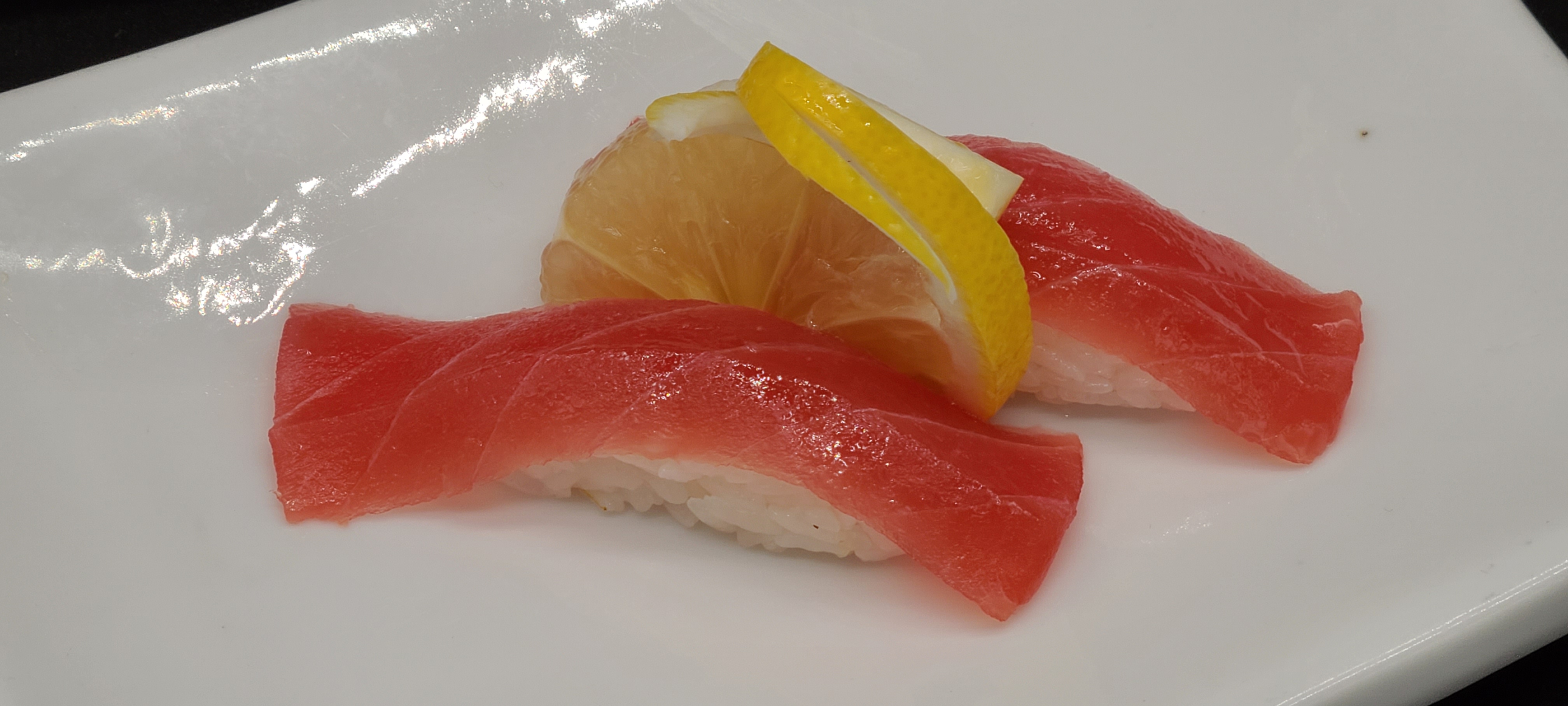 Order N5. Tuna Sushi(2pcs) food online from Hello Sushi store, Fullerton on bringmethat.com