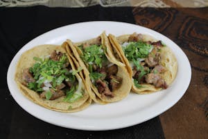 Order 3 Tacos de Carnitas food online from Miranda Mexican Restaurant store, Winder on bringmethat.com