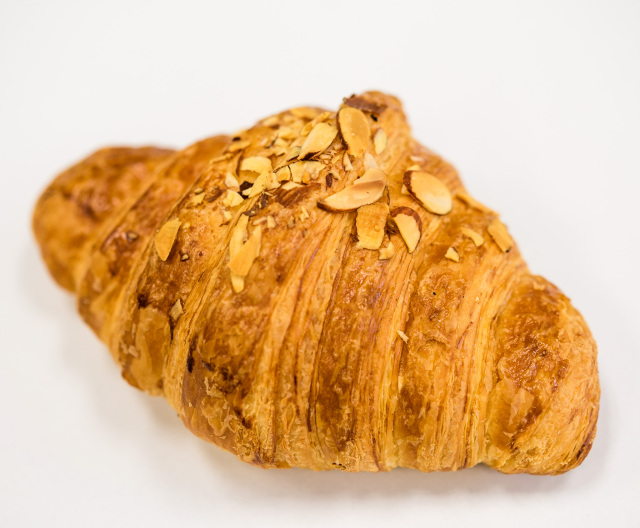 Order Almond Croissant food online from Bona Coffee Roasters store, Boulder on bringmethat.com