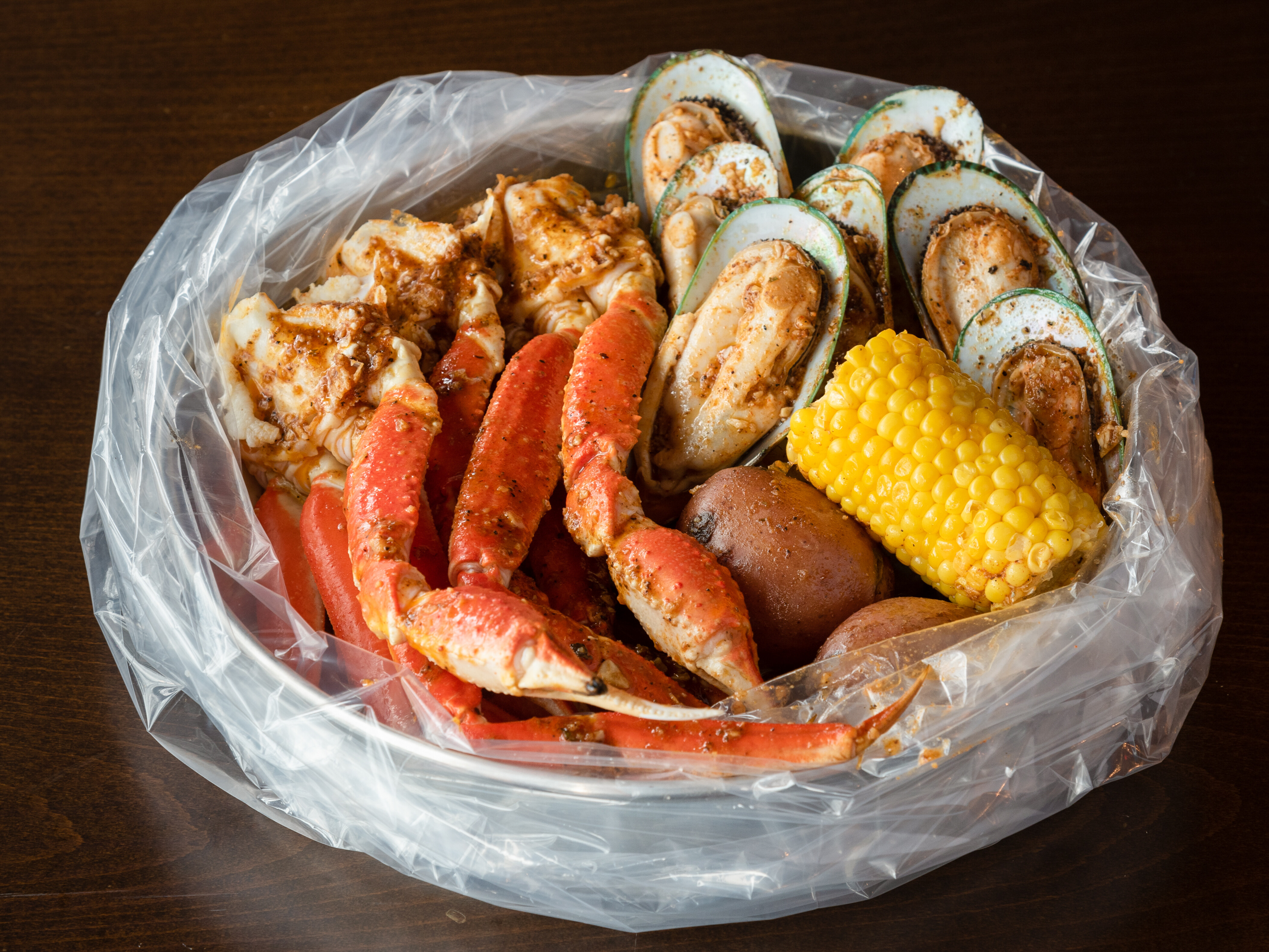 Order 2. Snow Crab Leg and Mussel Combo food online from Shaking Seafood store, Roslindale on bringmethat.com