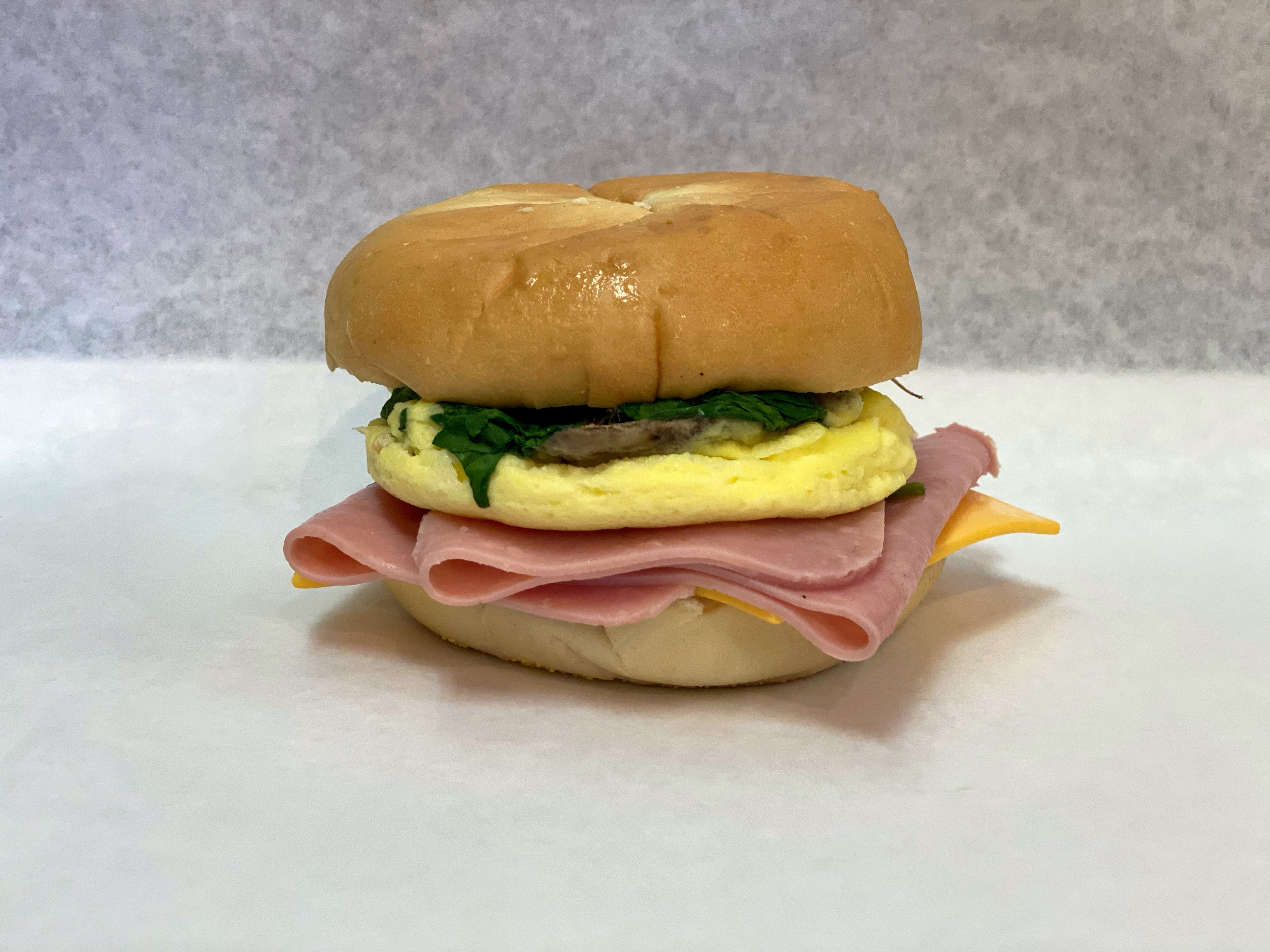 Order 16A. Egg, Ham, Spinach, Mushroom, & Cheese food online from Bagel Place Cafe store, Sunnyvale on bringmethat.com