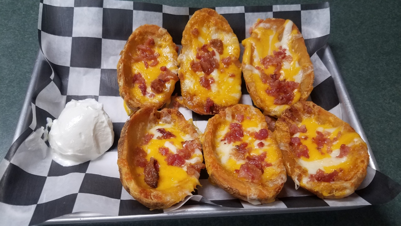 Order *Loaded Potato Skins food online from The Distillery Restaurant store, Victor on bringmethat.com