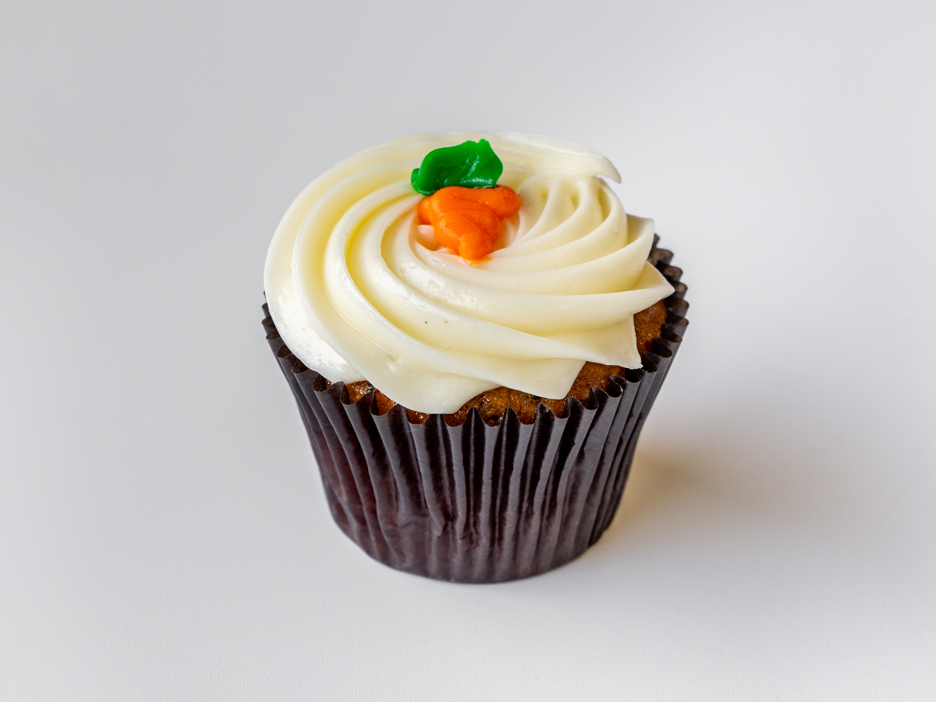 Order Carrot Cream Cheese Classic Cupcake food online from Yummy Cupcakes store, Encinitas on bringmethat.com