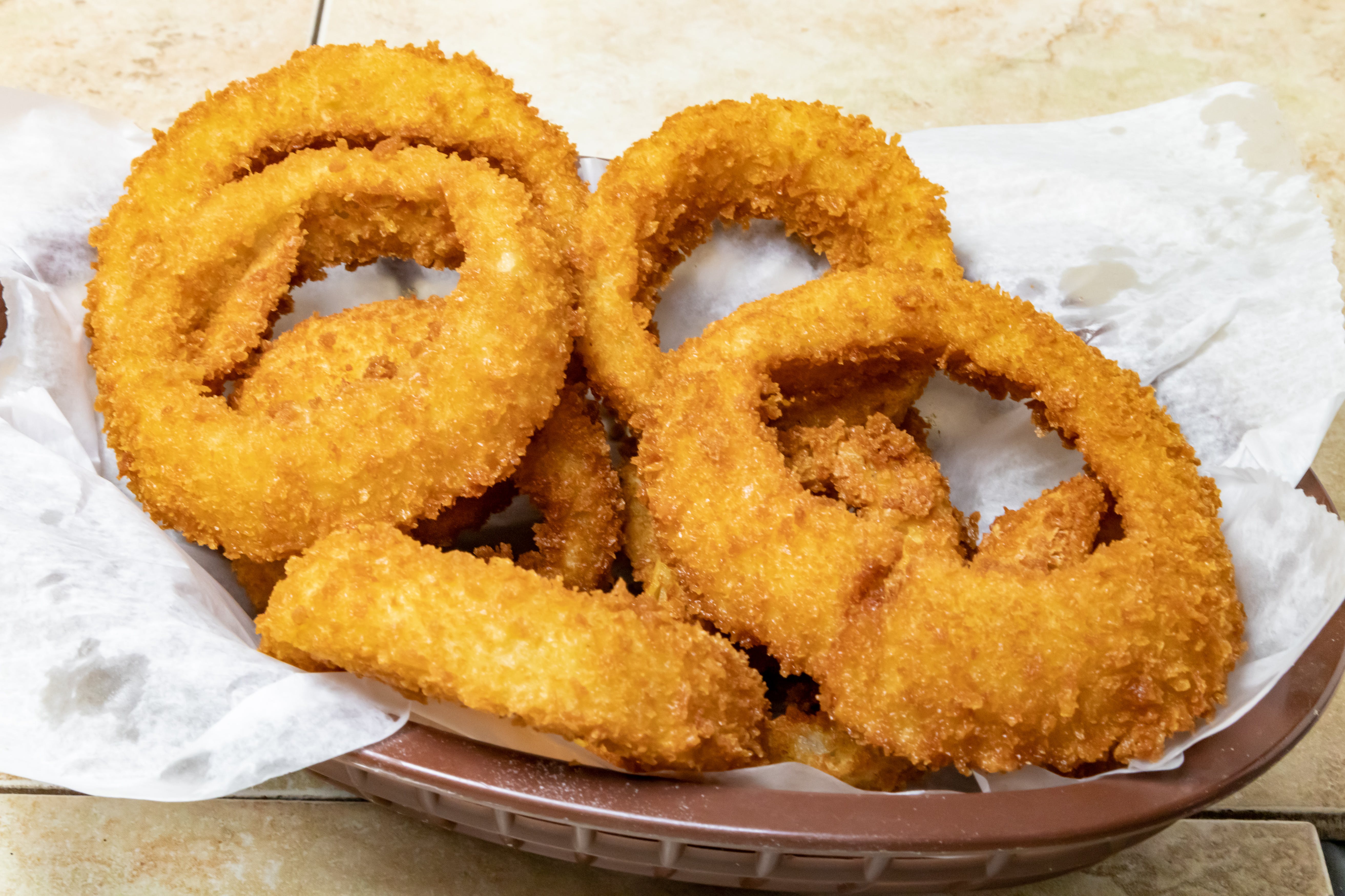 Order Onion Rings - Side food online from Novotny's Groceries & Pizza store, Worthington on bringmethat.com