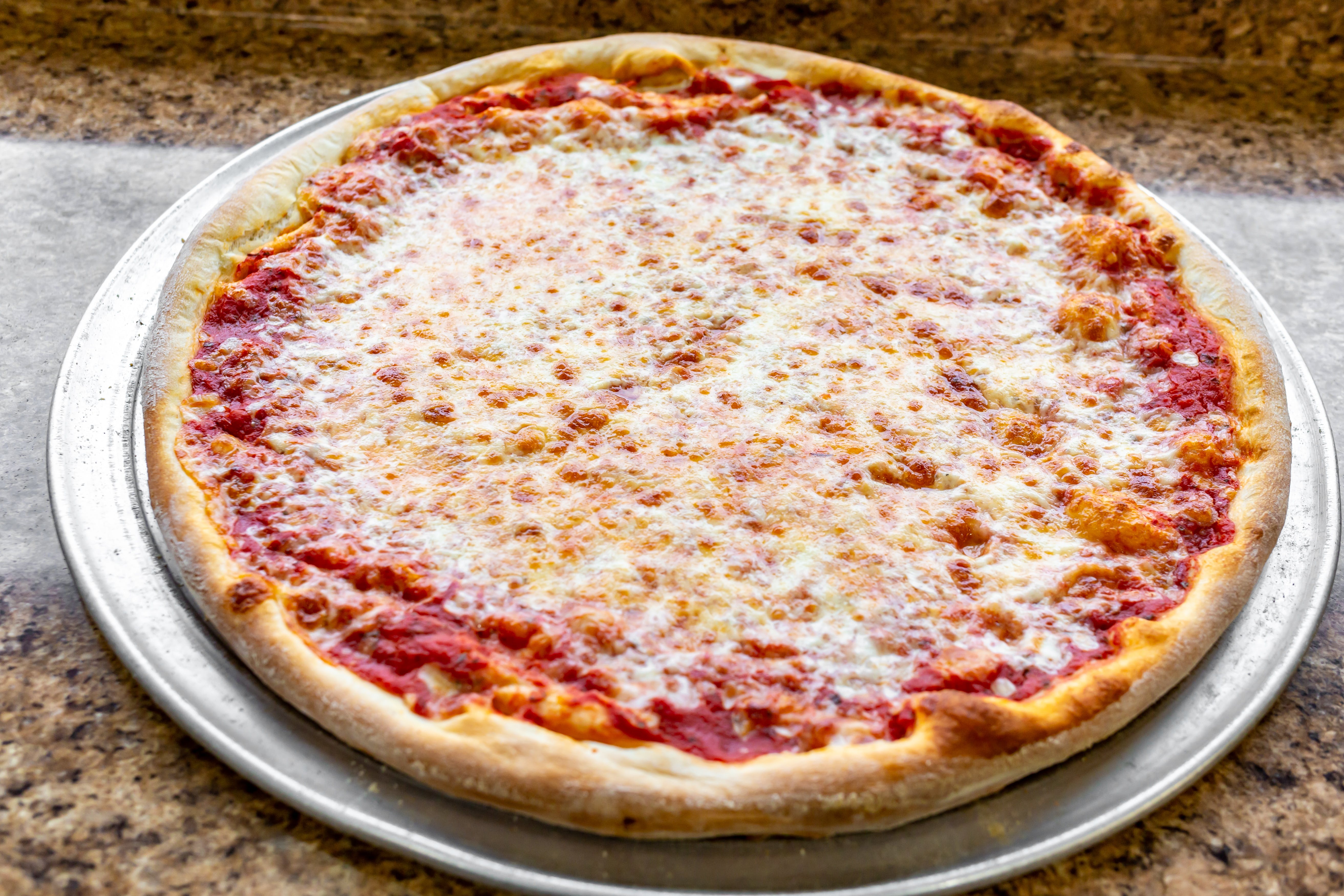 Order Cheese Pizza - Large food online from Lorenzo's Pizza store, St James on bringmethat.com