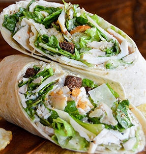 Order Chicken Caesar Wrap food online from Tops American Grill, Bakery, & Bar store, Schenectady on bringmethat.com