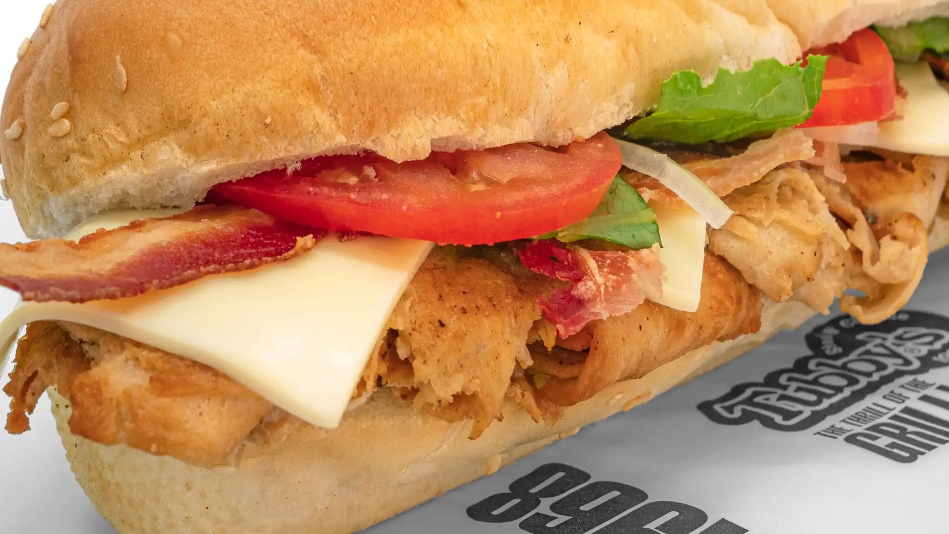 Order Chicken Club Sub - Small food online from Tubby's Grilled Submarines store, Westland on bringmethat.com