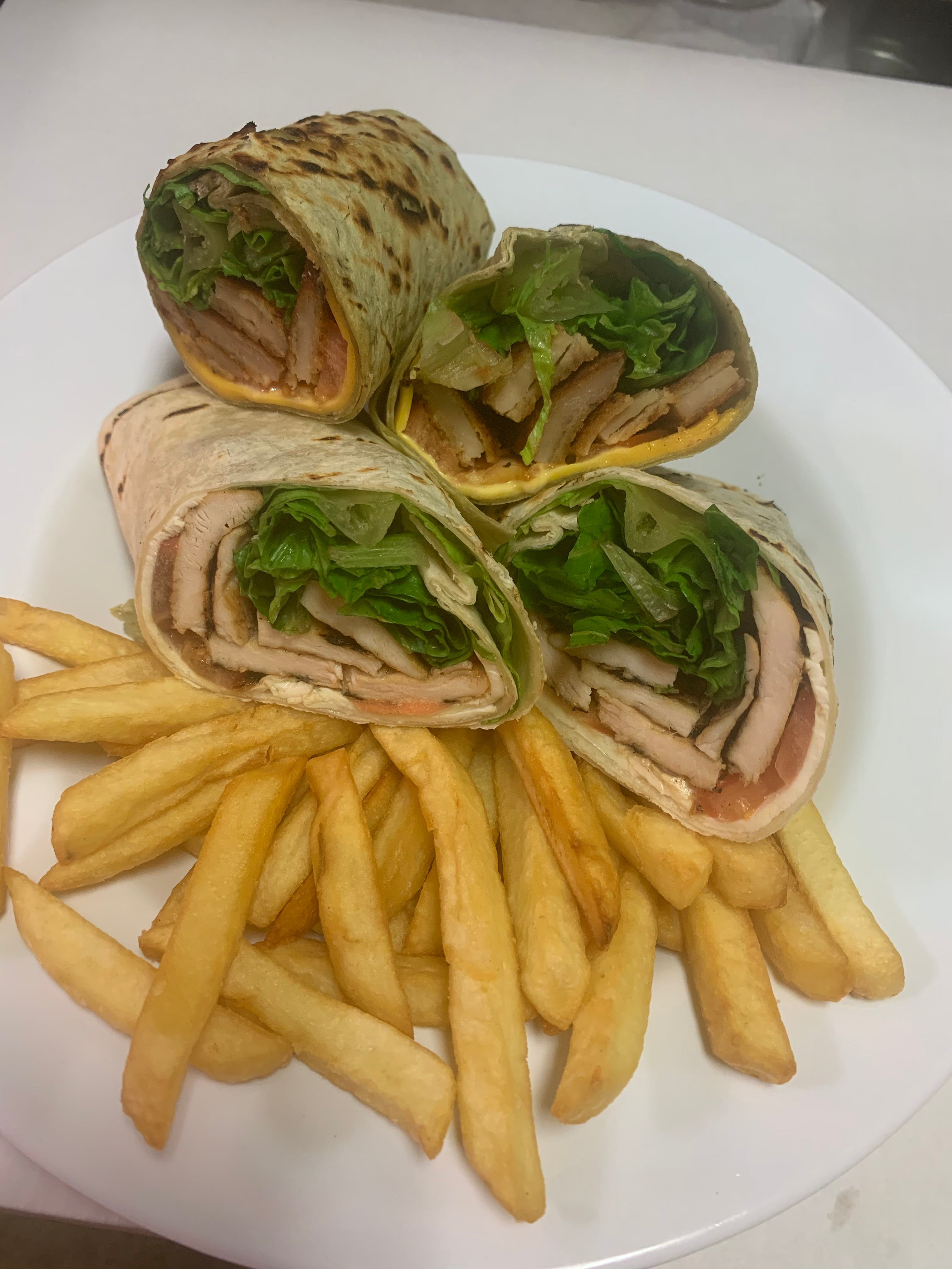 Order Grilled Chicken Italiano Wrap - Wrap food online from Taste of Italy Pizzeria store, Corona on bringmethat.com