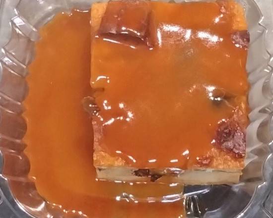 Order Caramel bread pudding  food online from AGAPE KITCHEN & PRALINES store, Humble on bringmethat.com