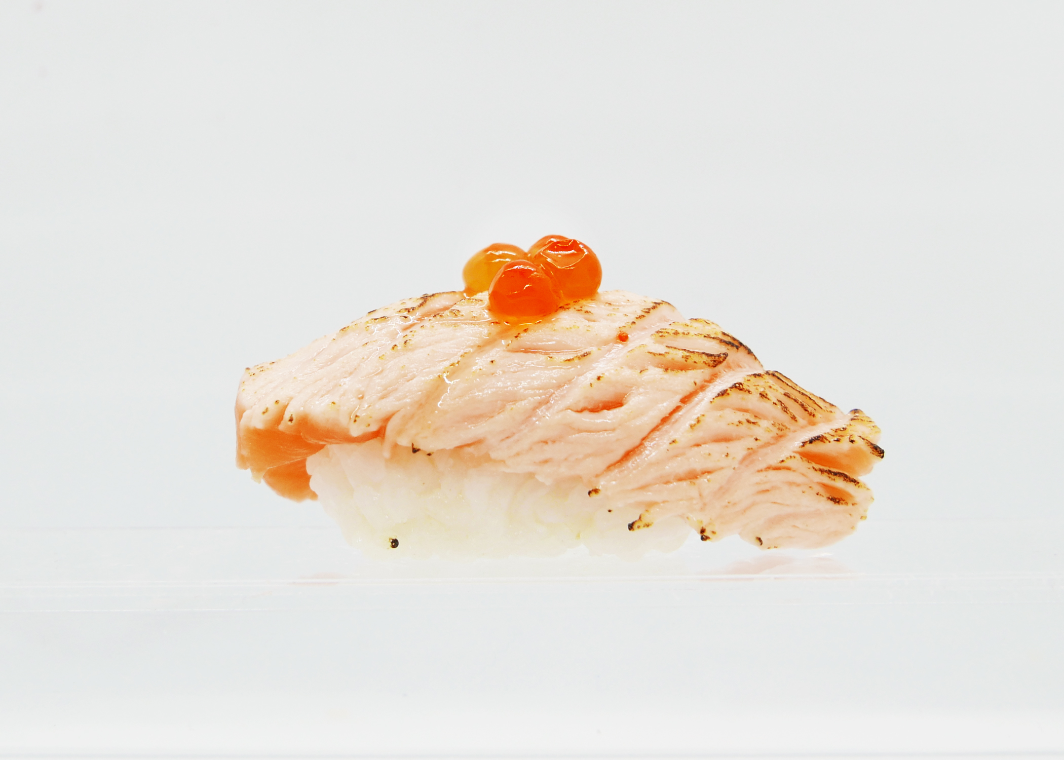 Order Sear Fresh Salmon topped with Ikura food online from Shinju Sushi store, Chicago on bringmethat.com
