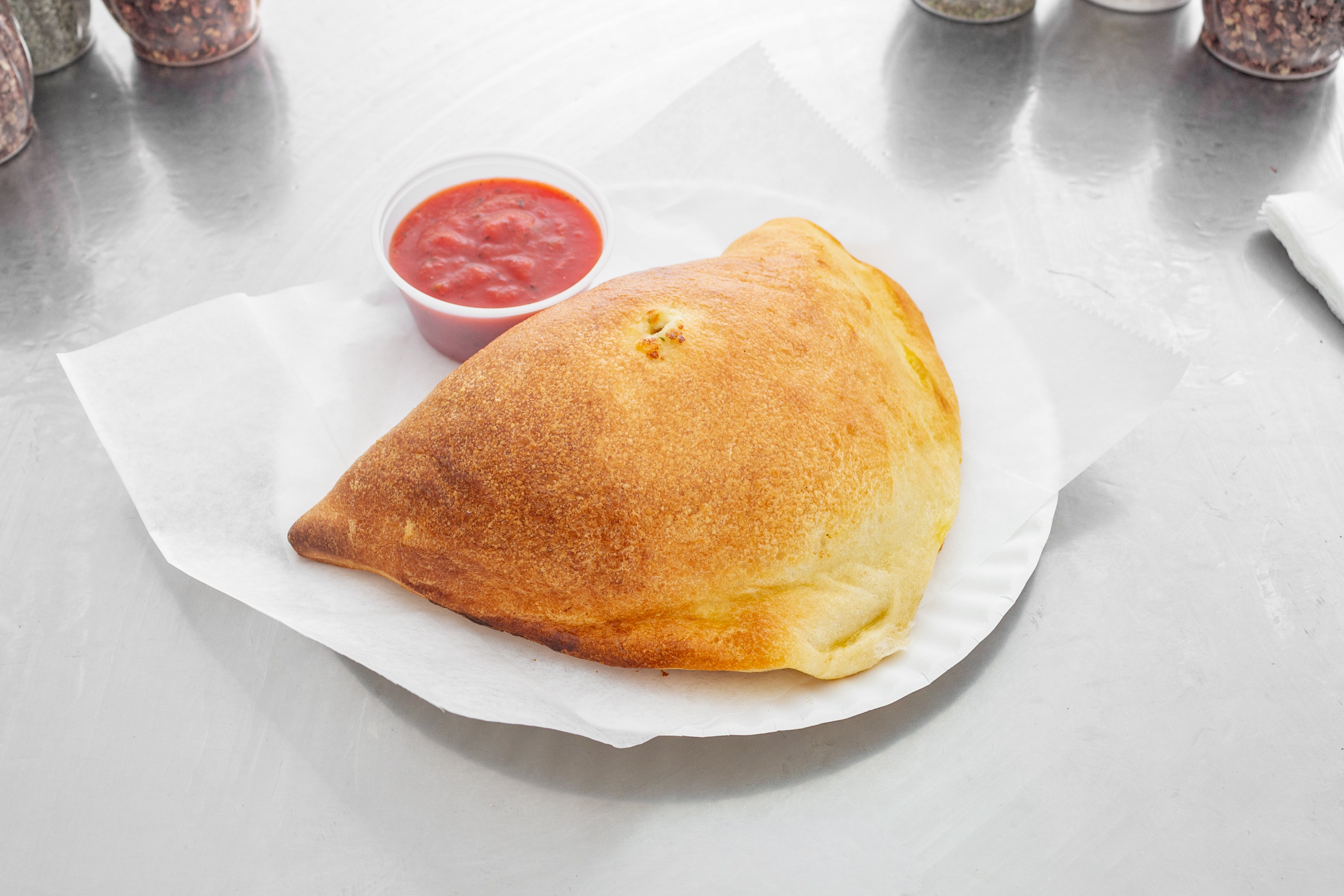 Order Cheese Calzone - Calzones food online from Not Ray Pizza store, Brooklyn on bringmethat.com