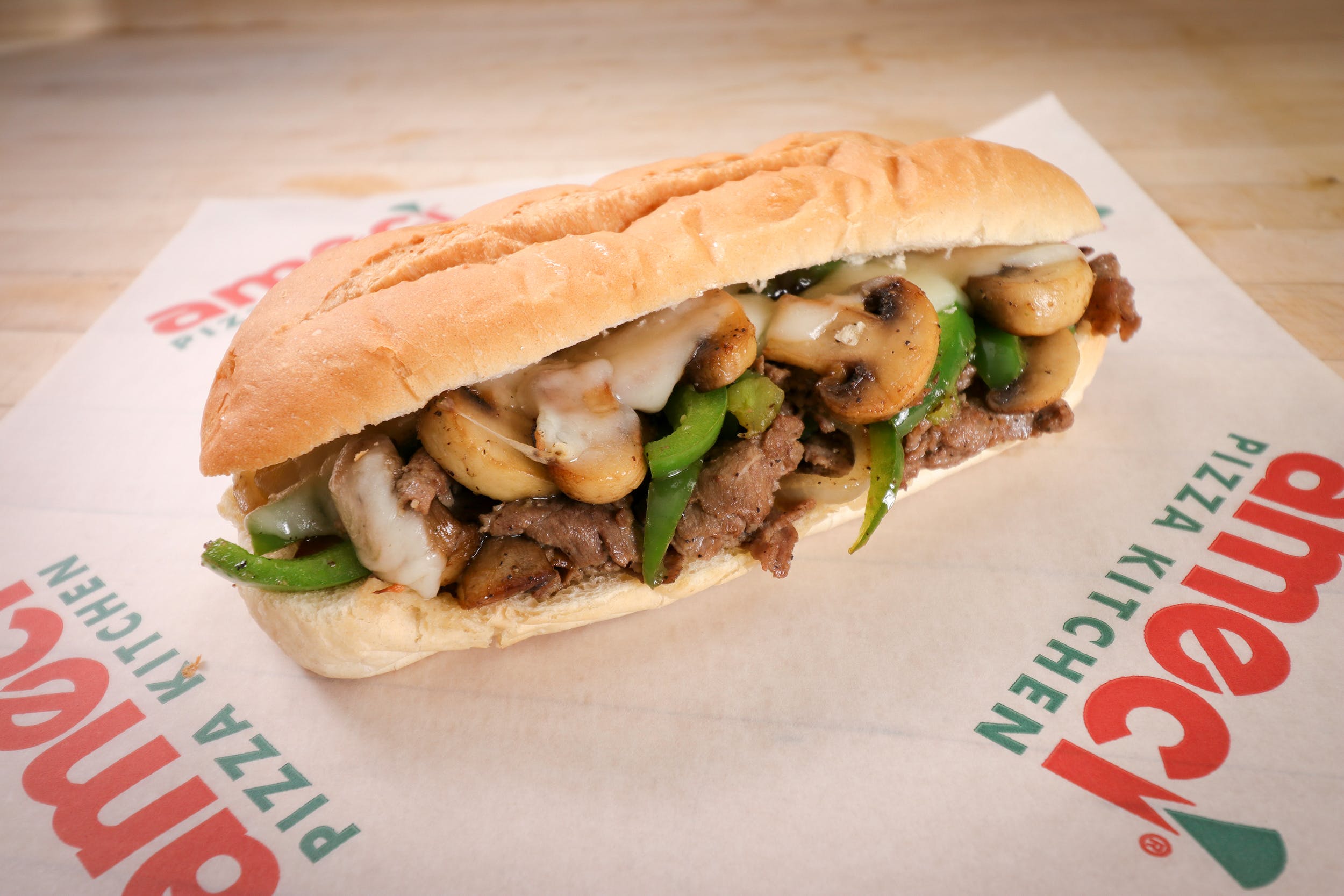 Order Philly Cheesesteak Sandwich - Half 6" food online from Ameci Pizza store, Camarillo on bringmethat.com
