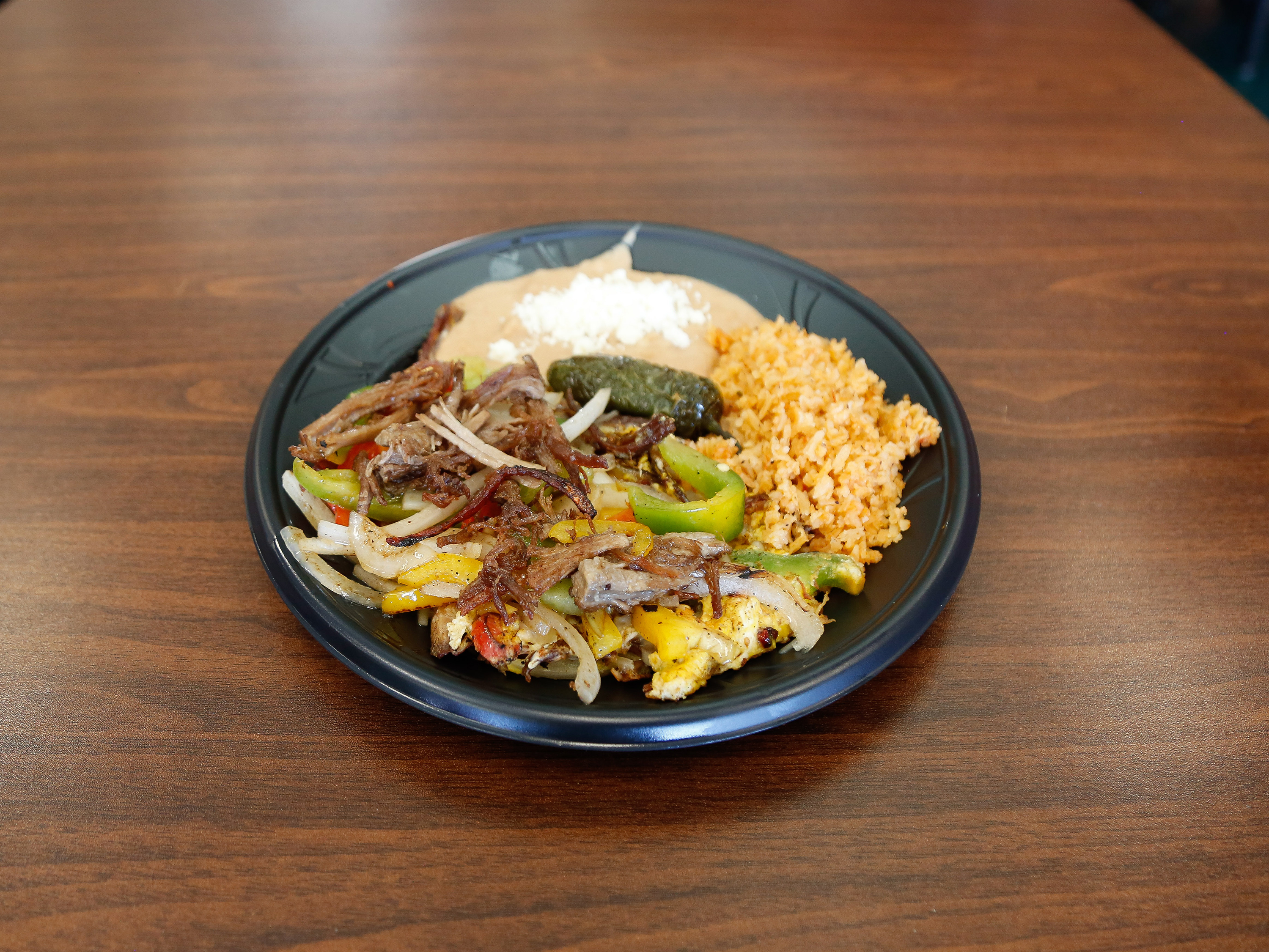 Order Machaca, Beens and Rice Plato food online from Hacienda Market & Grill store, Carson City on bringmethat.com