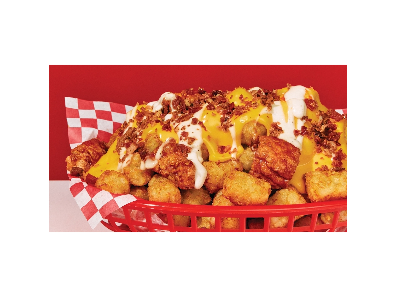 Order Cheesy Chicken Loaded Nachos: Tots food online from Wings Over store, Greenville on bringmethat.com