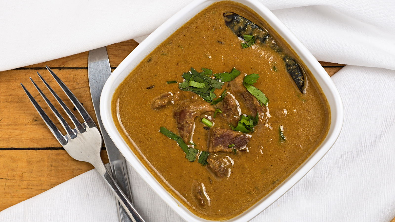 Order Lamb Curry food online from Thalaiva's Indian Kitchen store, Park Ridge on bringmethat.com
